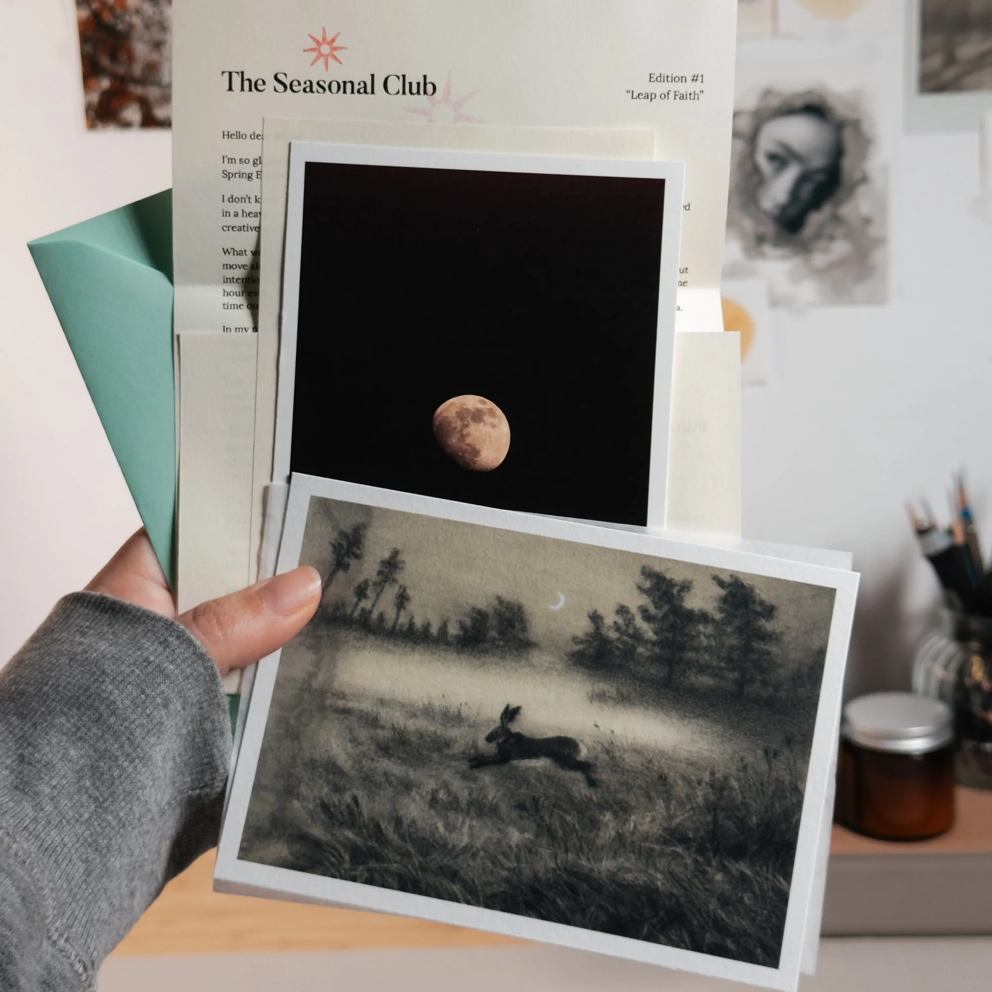 art snail mail package showing the giclee print for spring equinox, together with a moon postcard and letter from artist