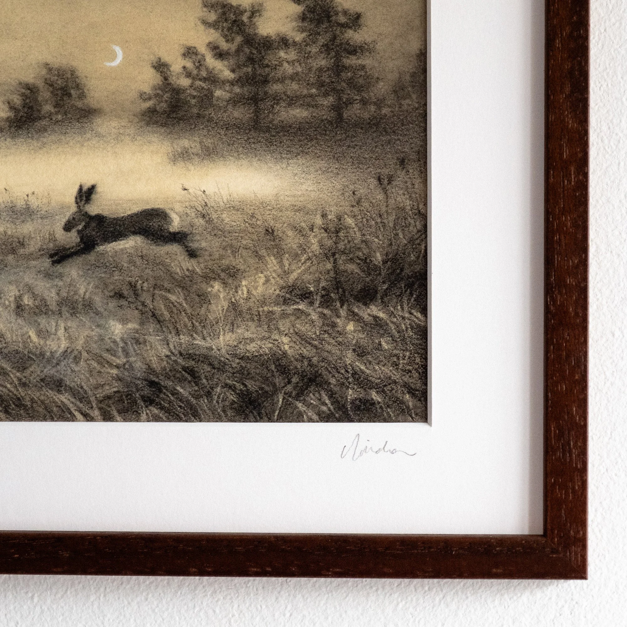 close up of Original framed drawing of a leaping hare in a moonlit field at dusk. Features charcoal textures and symbolizes the Spring Equinox