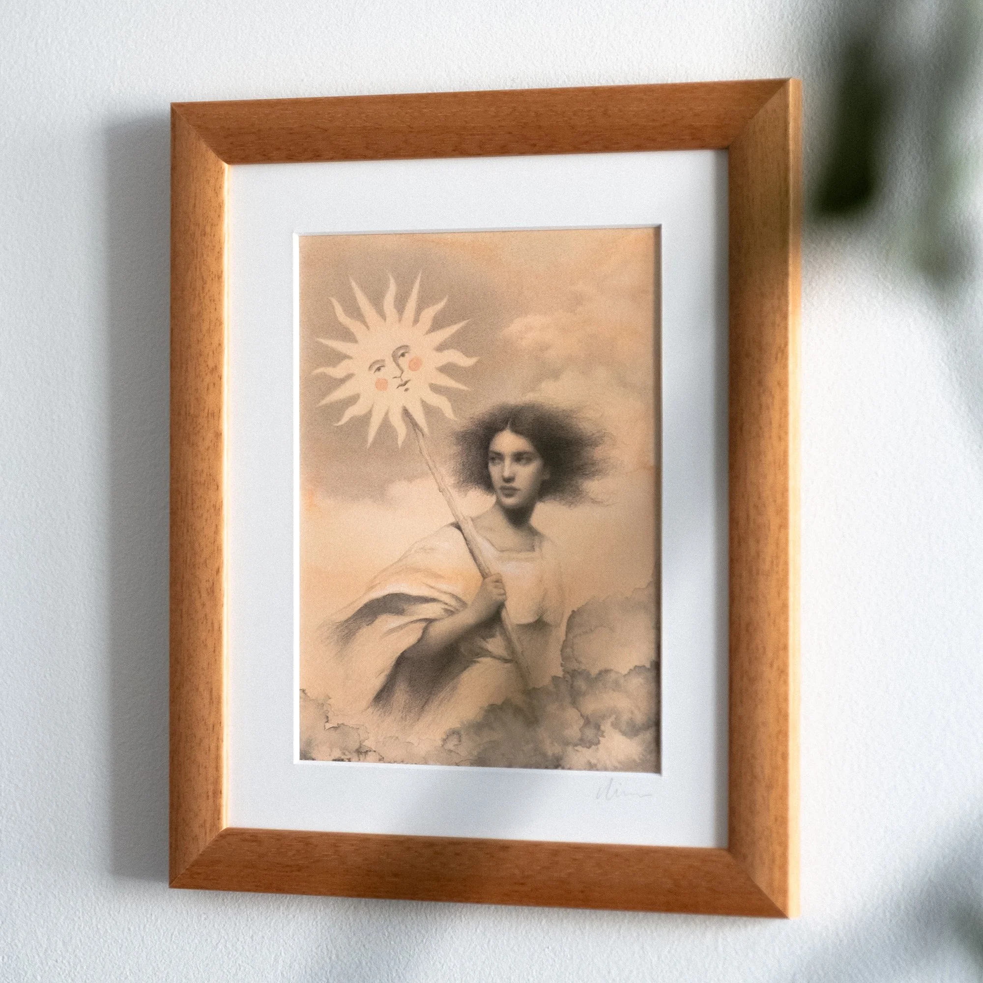 A side-angle view of "The Sun Bearer" original drawing, showing the warm wood frame. The perspective highlights the professional framing and the crisp presentation of the graphite drawing