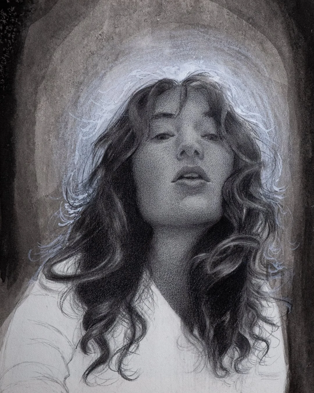 A detailed black and white portrait sketch of a woman with long, wavy hair and a confident expression. The background features a glowing halo-like effect around her head.