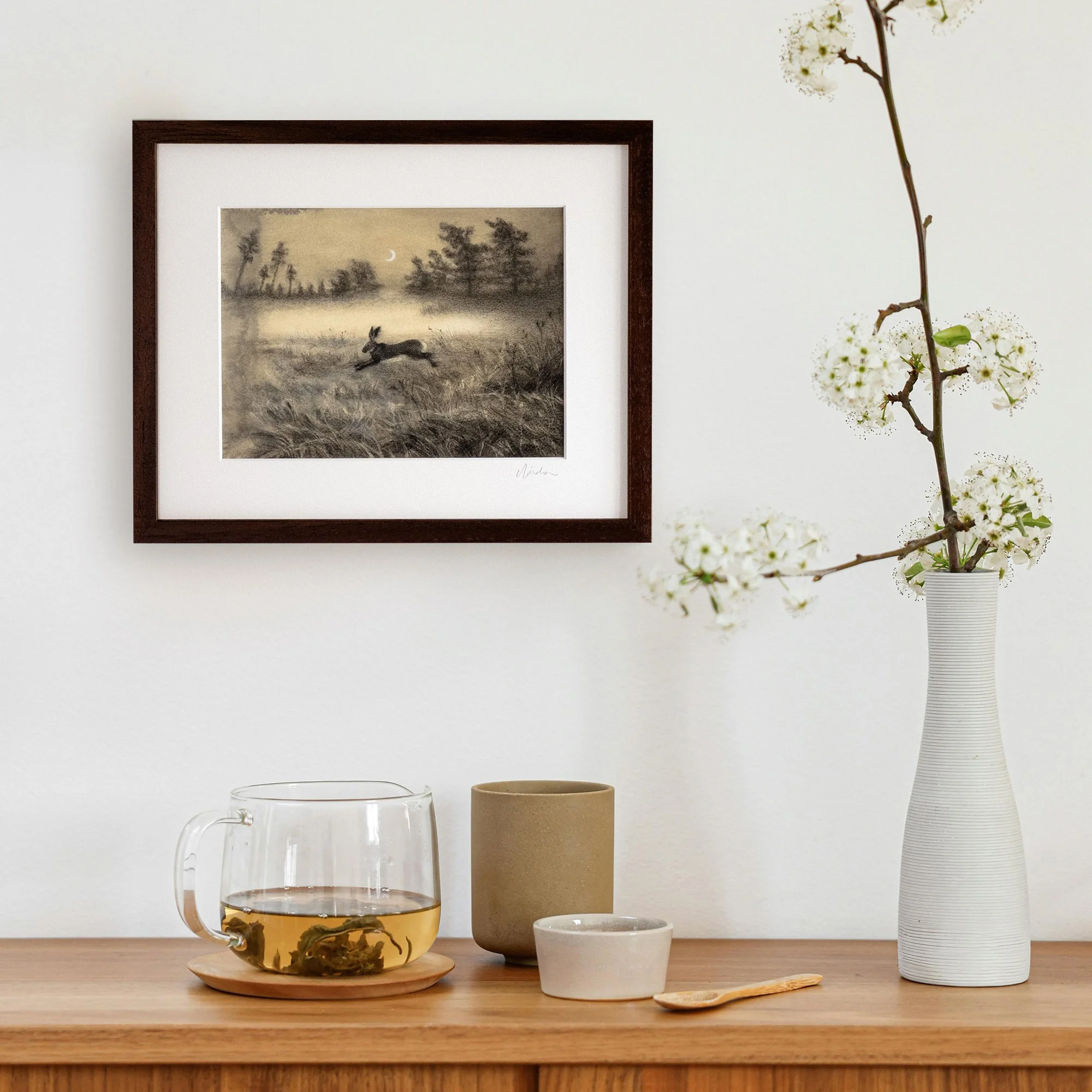 "Leap of Faith" by avidoma, Original framed mixed media drawing of a leaping hare in a moonlit field at dusk, with ethereal ink and charcoal details, symbolizing the Spring Equinox