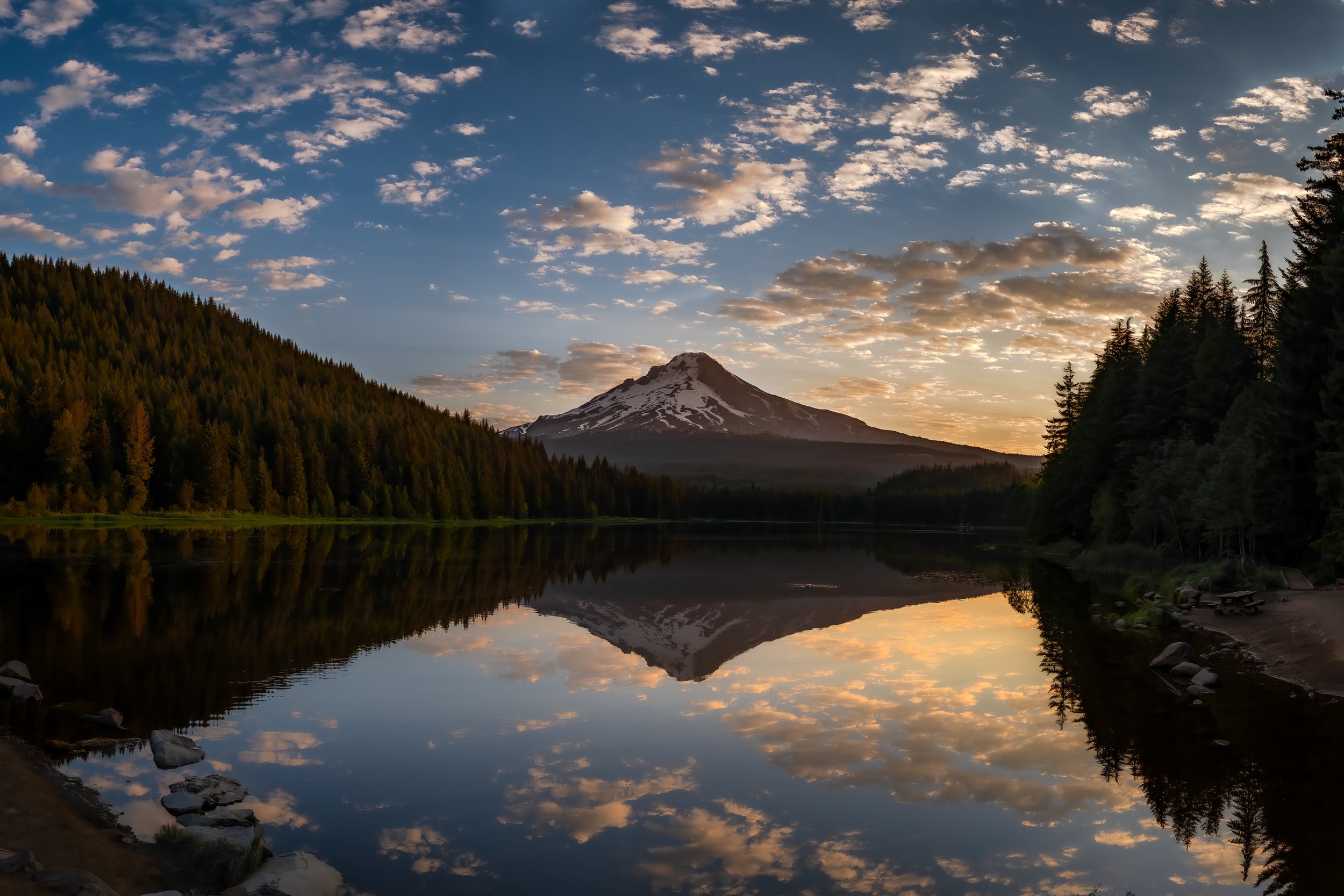 A cloudy sunrise reflection of Mt. Hood in Trillium Lake, OR.