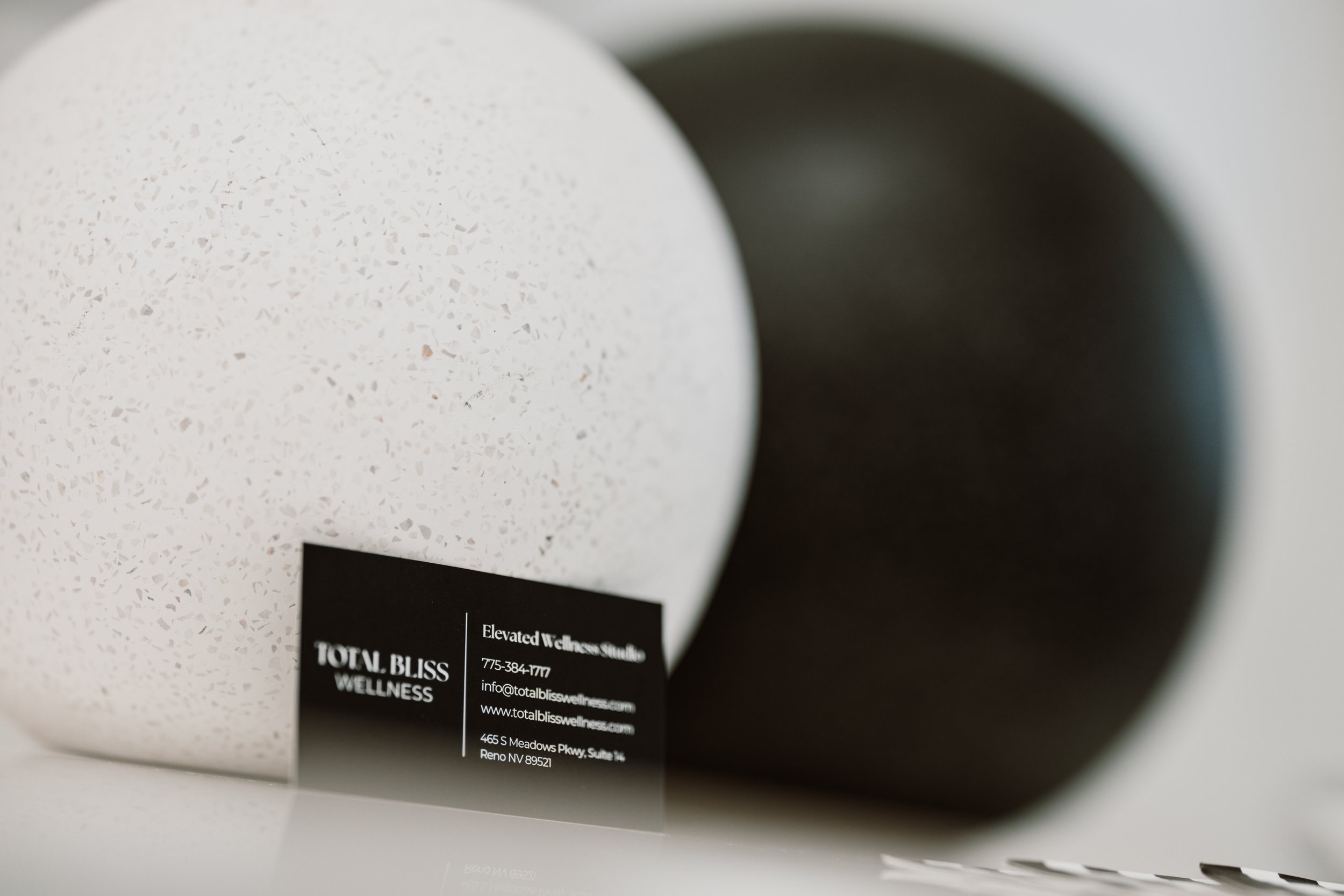 Total Bliss Wellness Business Cards on decor balls