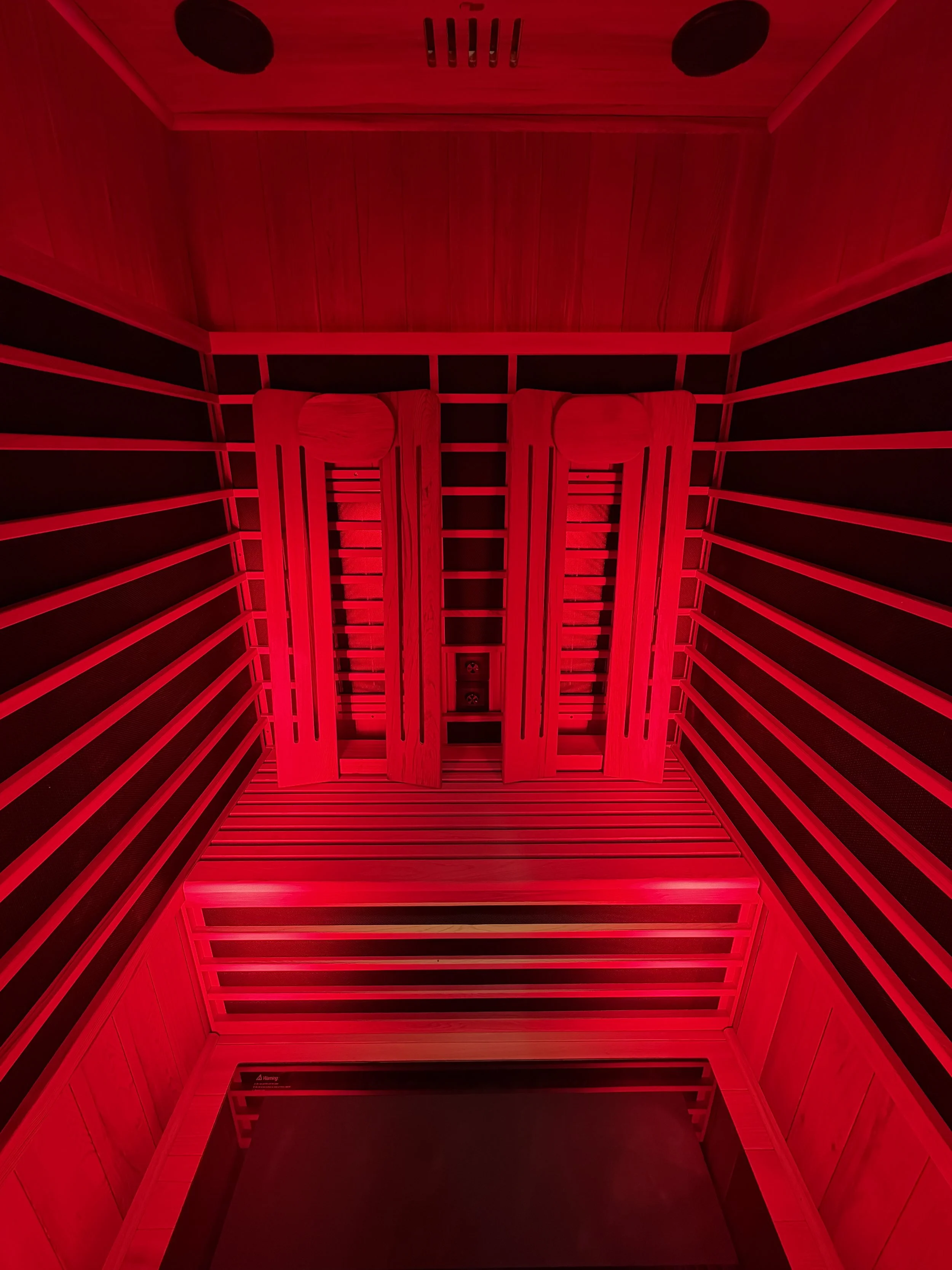 Inside of the Red Light Infrared Sauna offered at Total Bliss Wellness for all Red Light Therapy Benefits