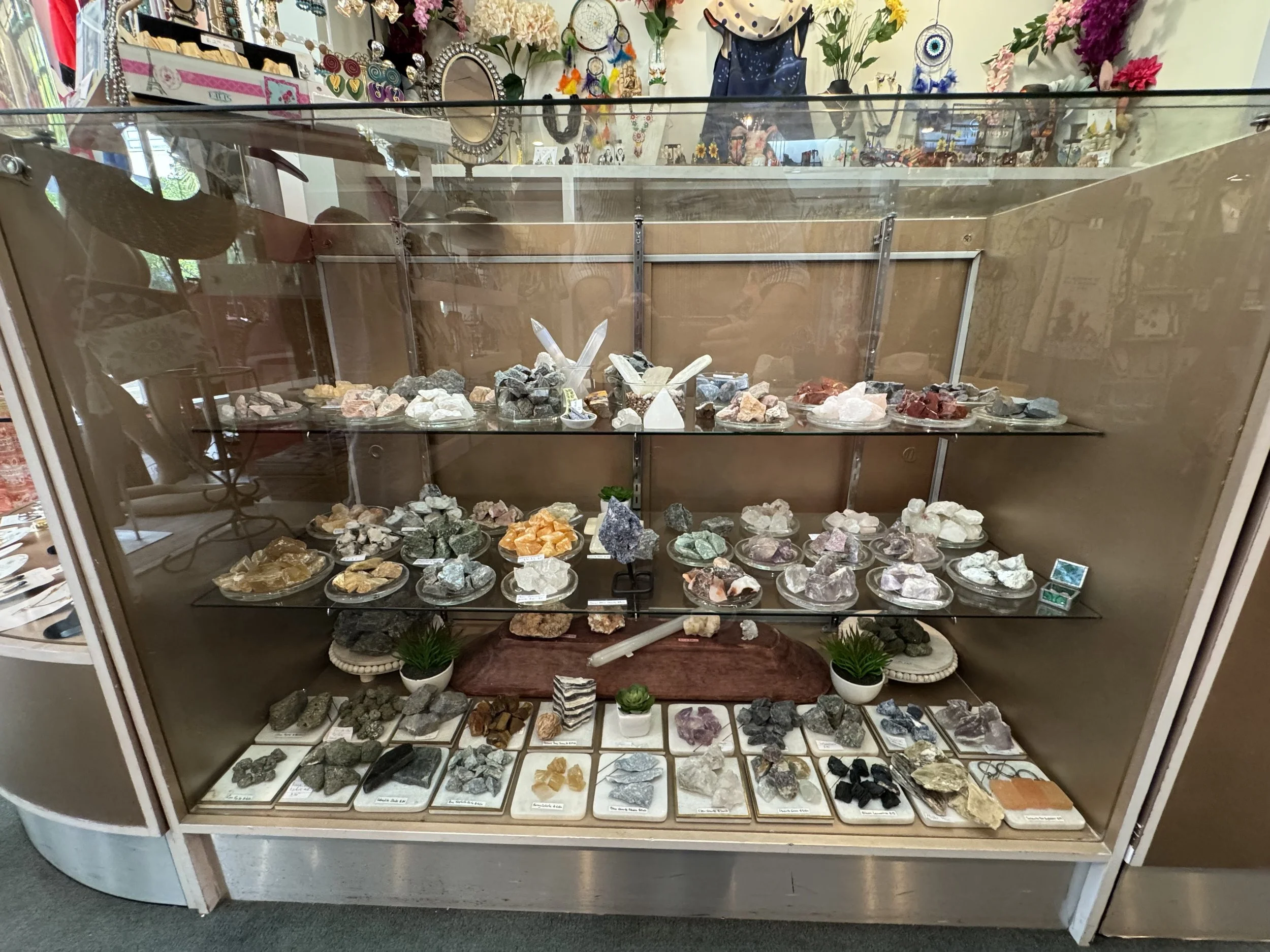 Variety of natural raw stones and inspirational protective amulets to elevate your energy and wellbeing