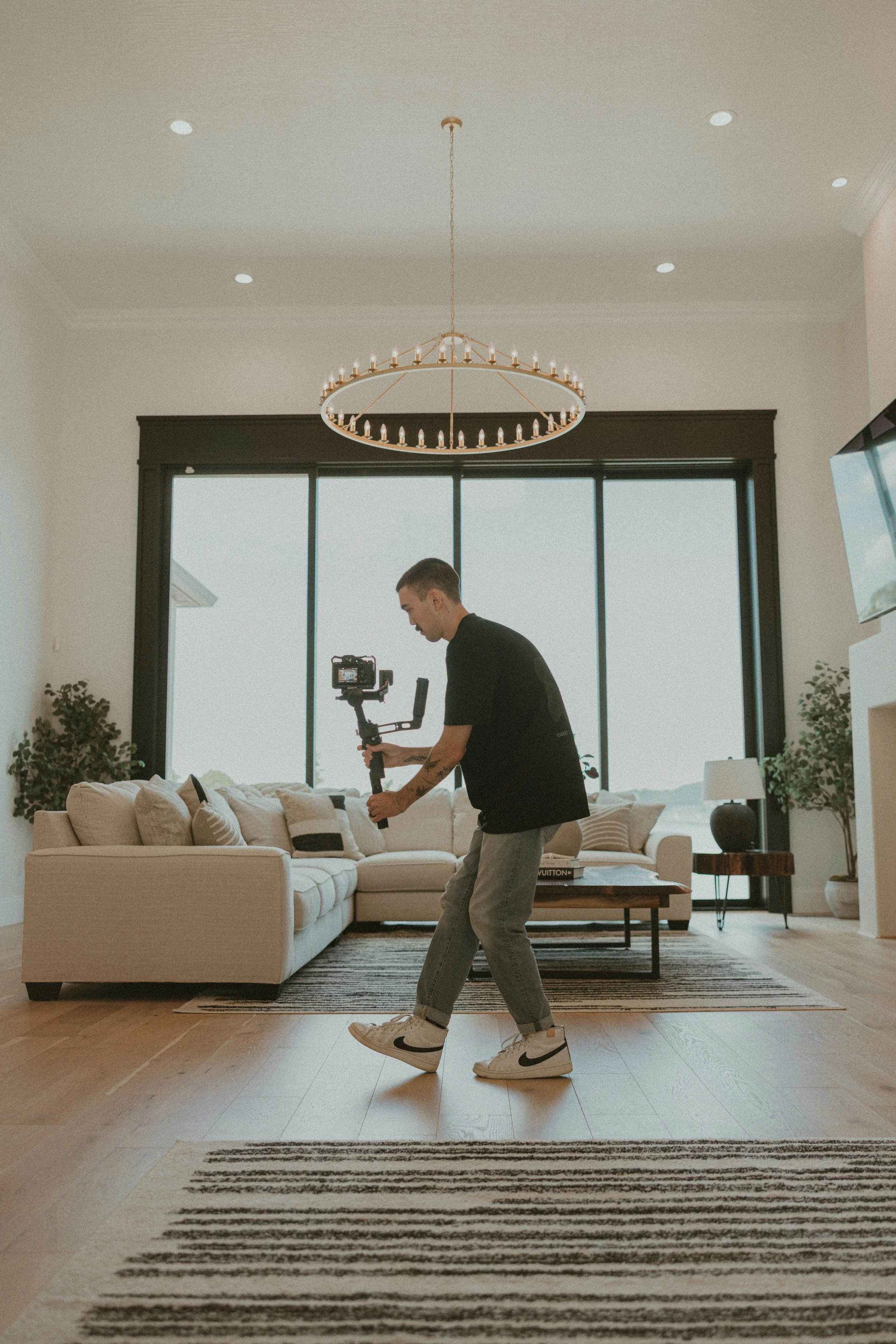 Luxury real estate videographer filming waterfront property