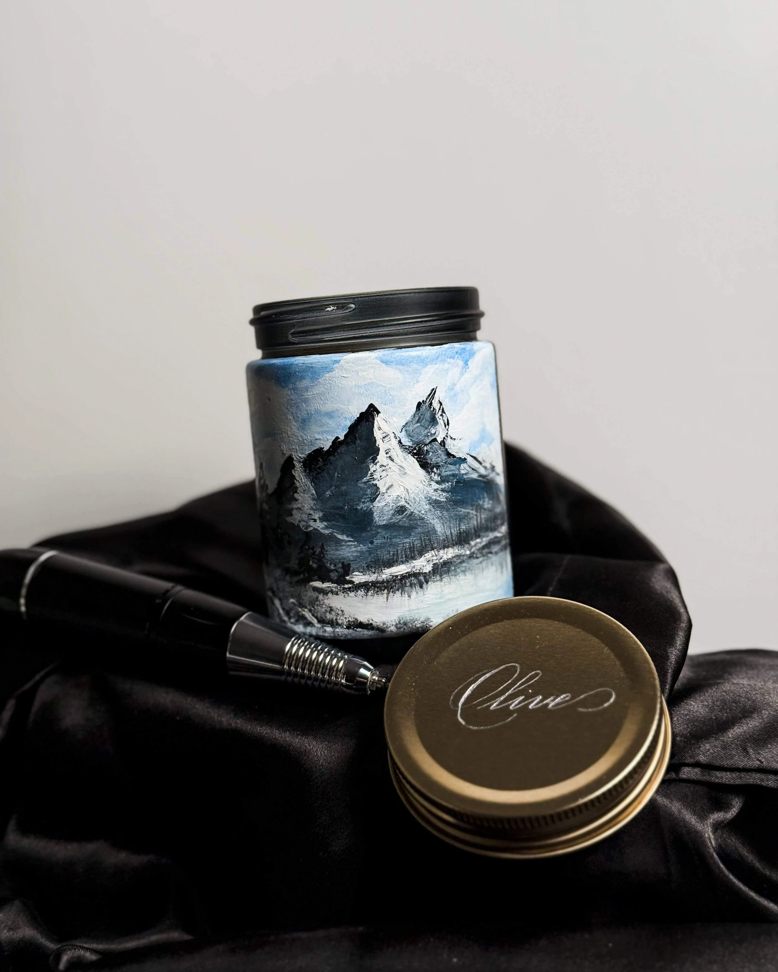 Candle with hand painted mountain scene and a hand engrave name on metal lid 