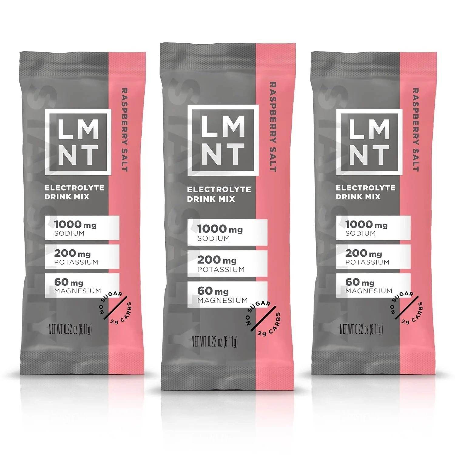 Three packets of LMNT Raspberry Salt electrolyte drink mix with pink and gray packaging, showing information about sodium, potassium, magnesium, and zero sugar or carbs.
