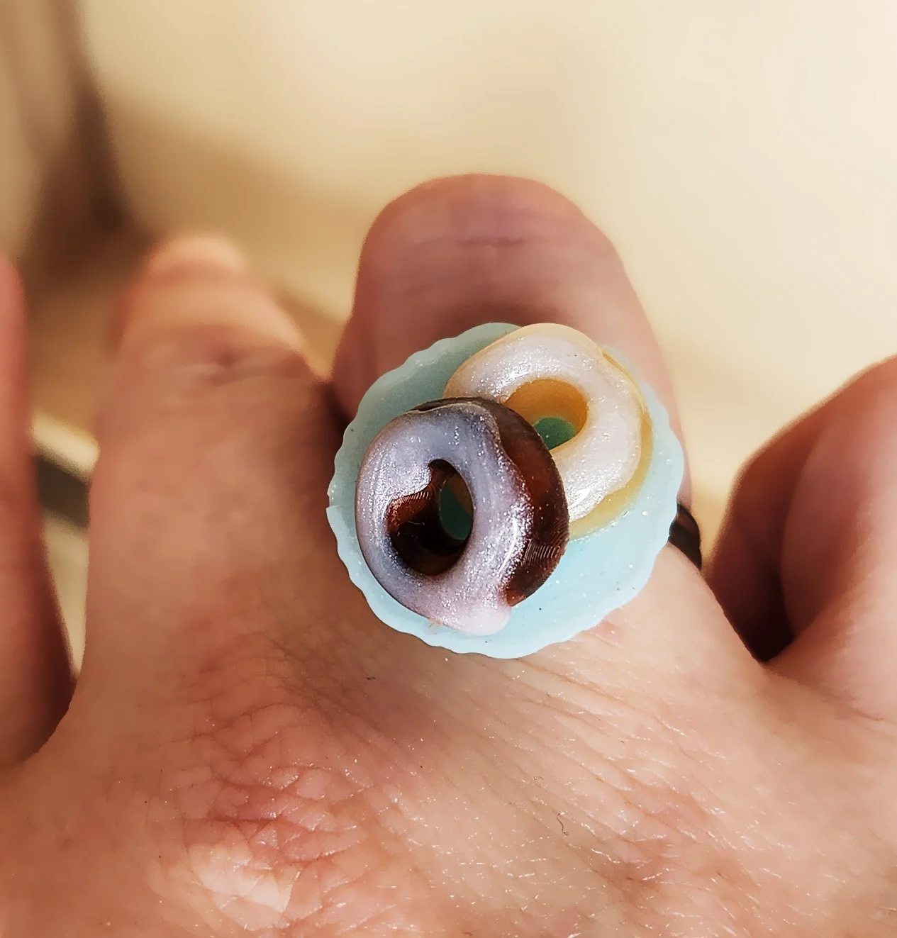 Glazed donuts ring
Adjustable metal ring with resin plate and two donuts with frosting