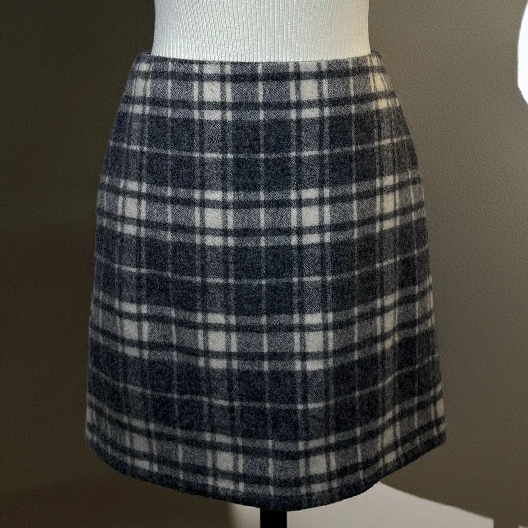Side angle of grey checkered wool skirt by UNIQLO, size 2