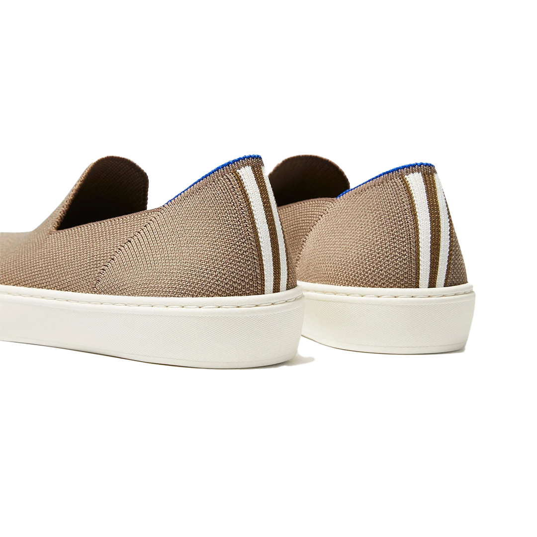 Side view of taupe Rothy’s slip-on sneakers with white sole, size 8.5