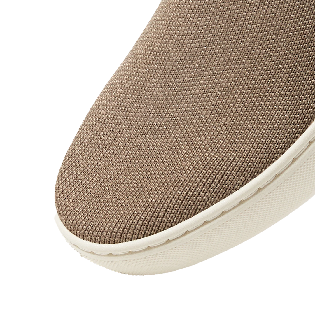 Top view of Rothy’s Original Slip-On sneakers in taupe and white colorways, size 8.5