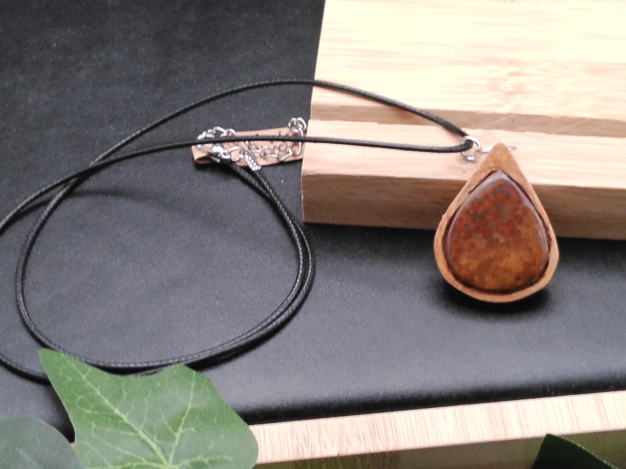 Plum agate set in wood