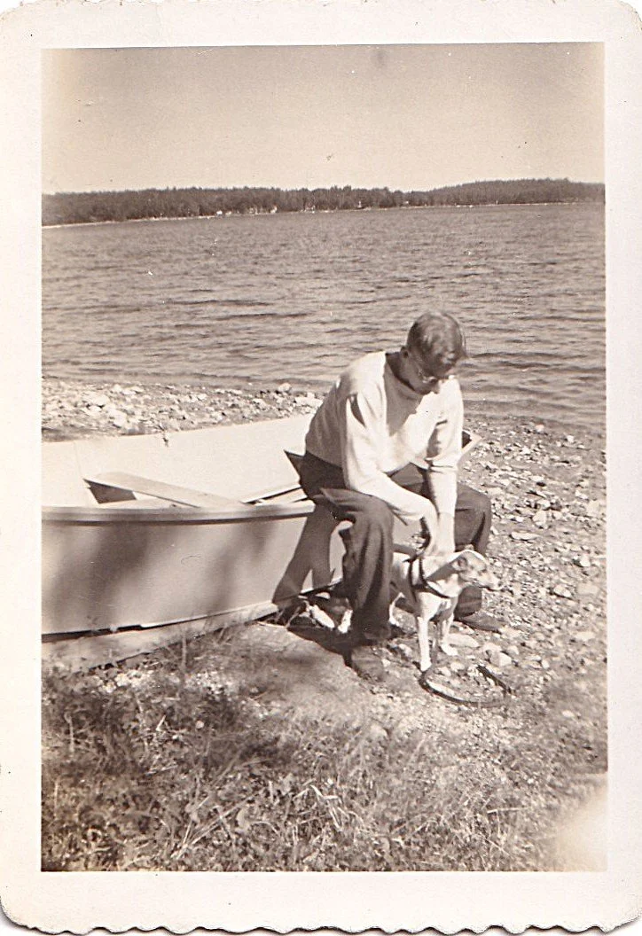Young John Mellor lakeside with Skippy