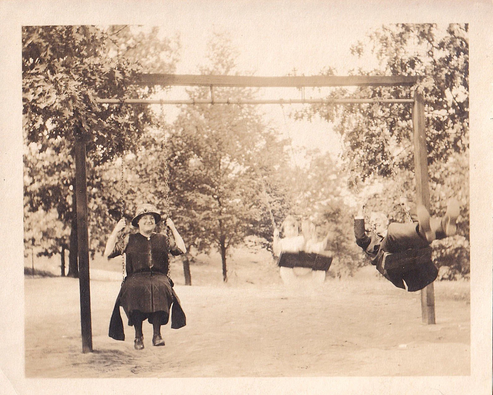 Ethel and Arnold on the swing with Mildred