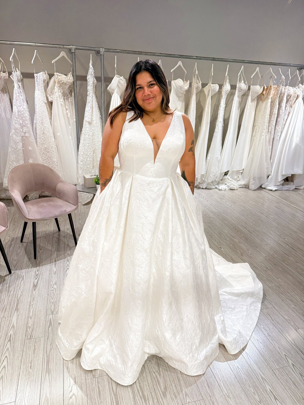 A bride in a ball gown in the With Love Bridal boutique