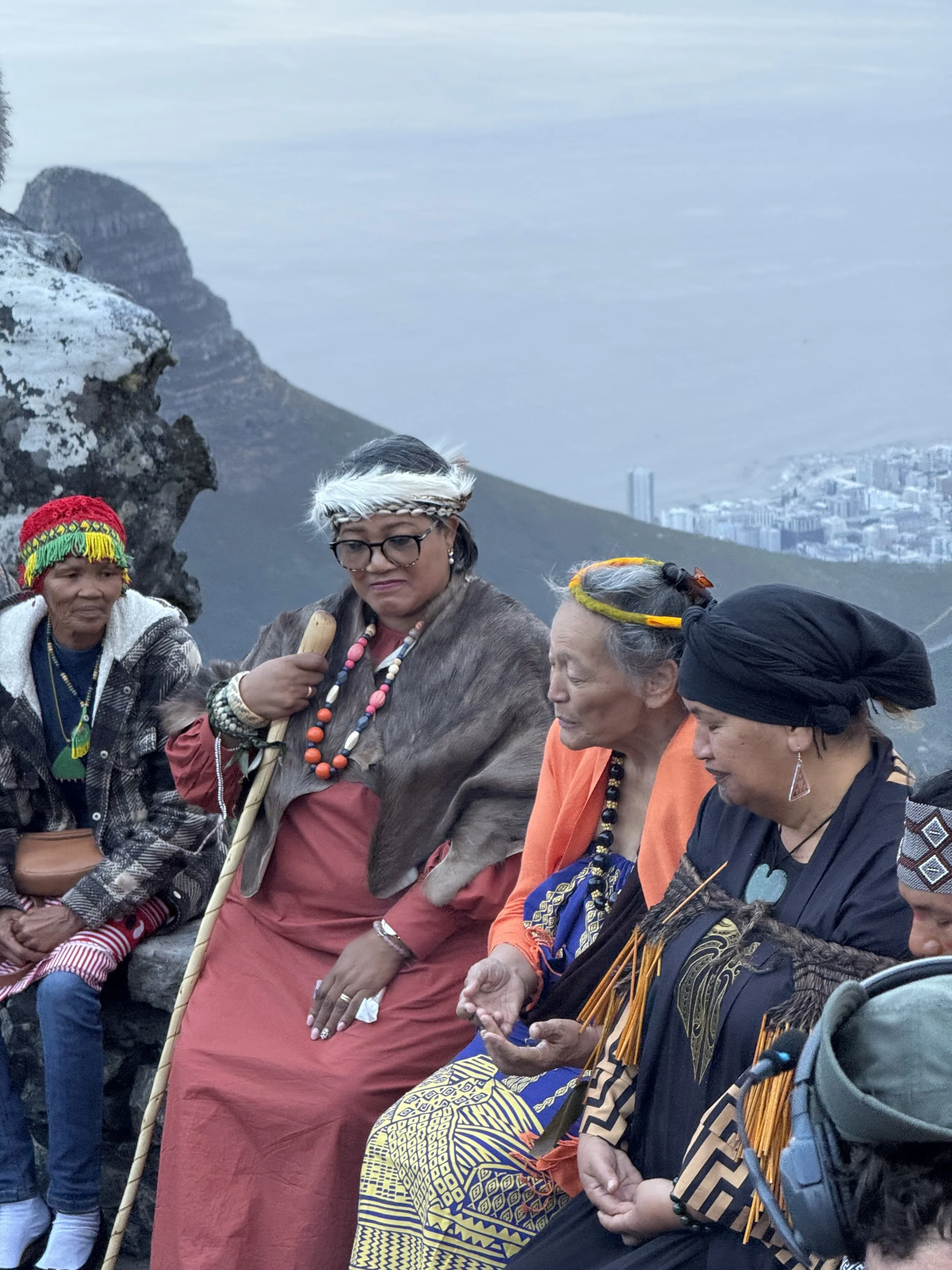Kumu Hula Puna Kalama Dawson, Kauaʻi, Tohunga Awhitia Mihaere, Aotearoa, HRH Queen Elouise, |Nu'ais Korana Kingdom, and San Elder Lydia Kruiper, Ubijie Tribe, Southern Kalahari
