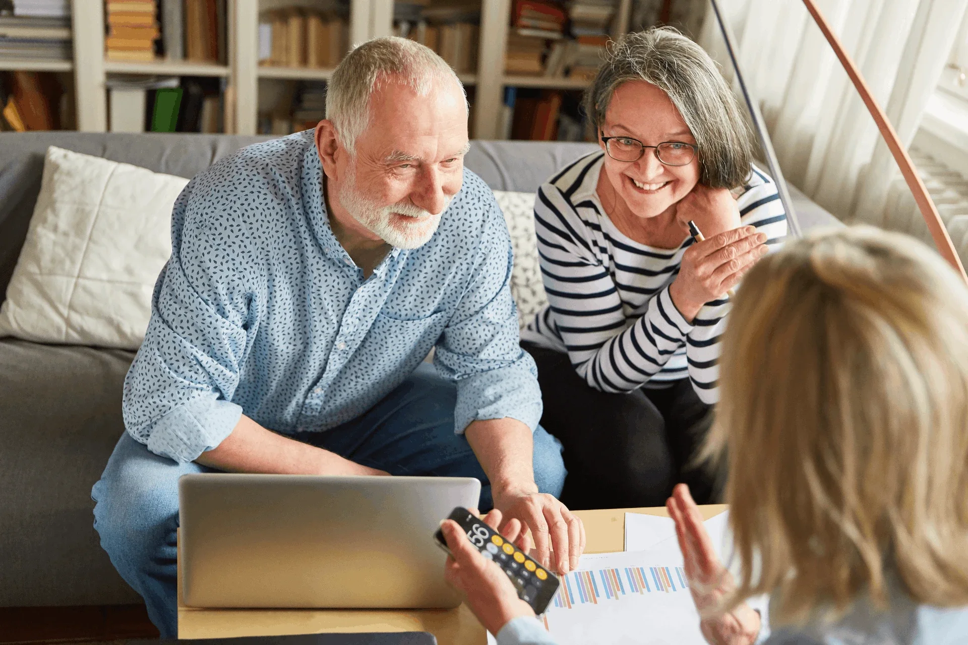 A retired couple talking with their private pension administrator