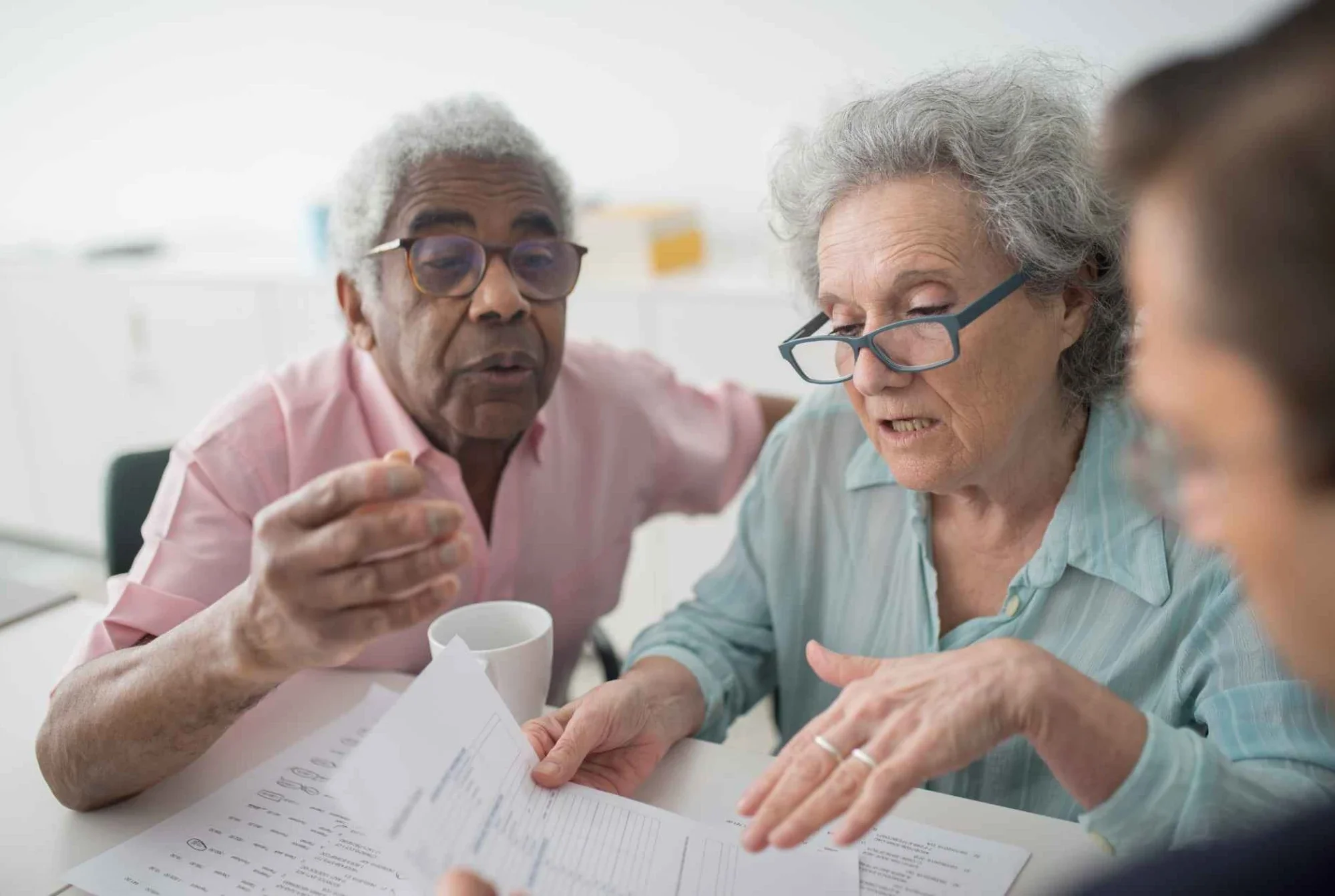 Couple meeting with a financial advisor to review a coordinated retirement plan