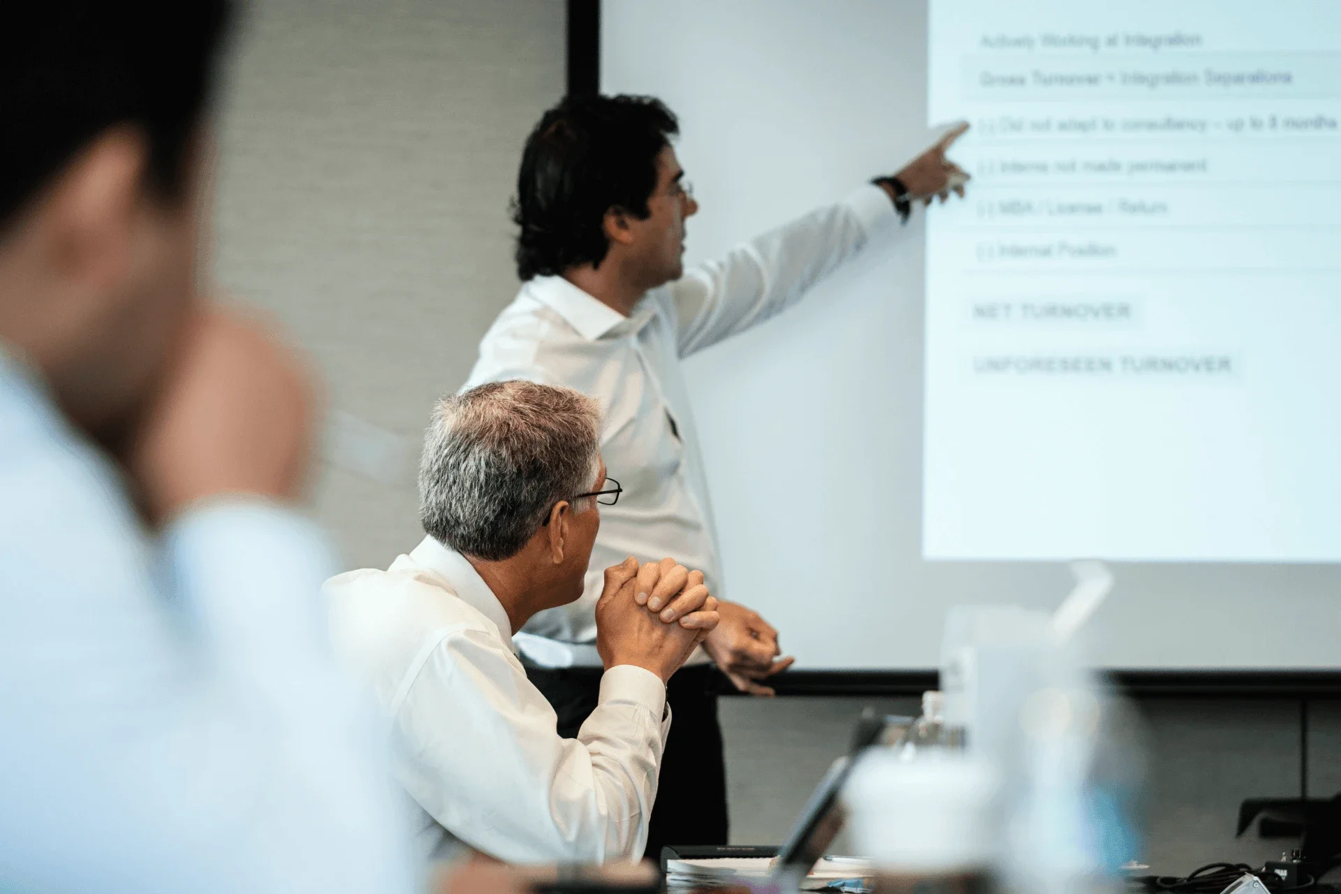 Executives in a meeting discussing business continuity plans
