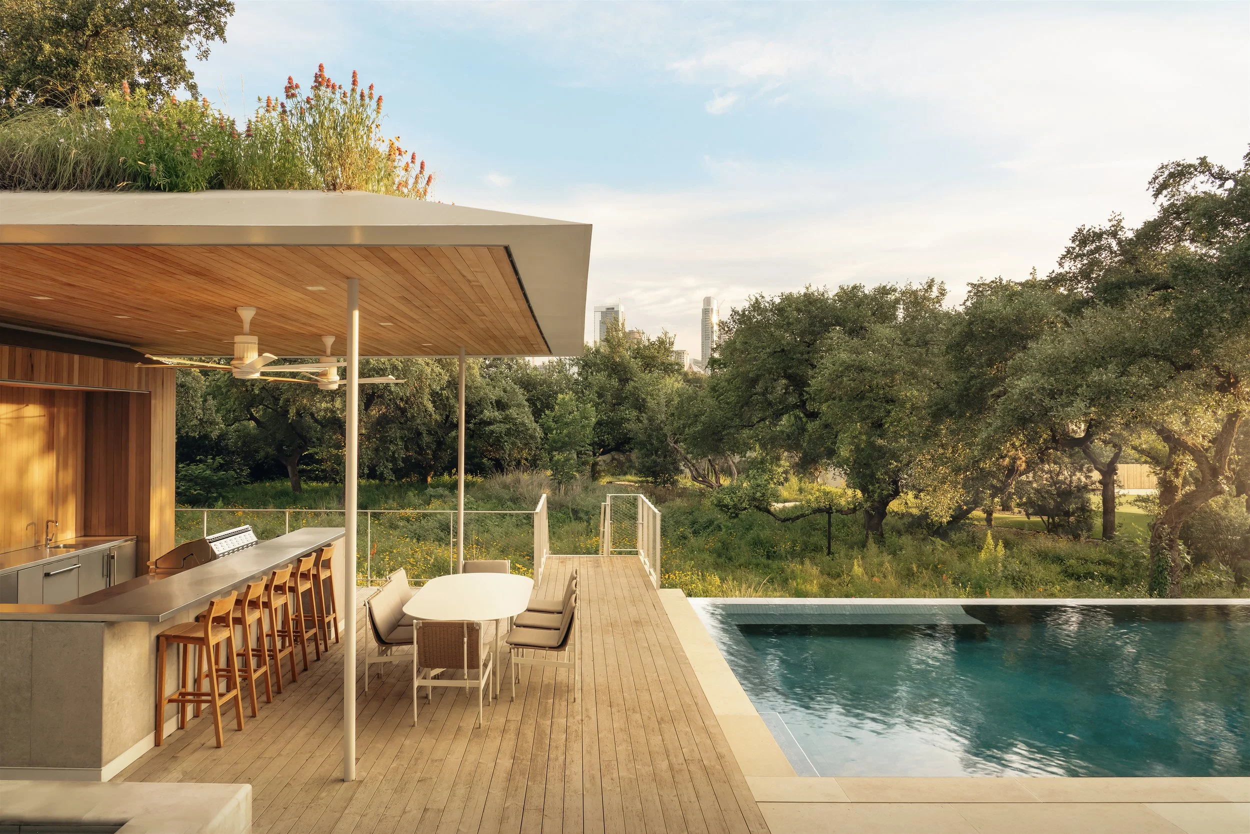 Travis Heights Pool House
2021
_
"Among the native gardens, the expansive back
yard is multifunctional and includes a pool,
lawn games court, sunken garden, fire pit, and
putting green as well as a landscaped prairie
roof meadow on top of the cabana,