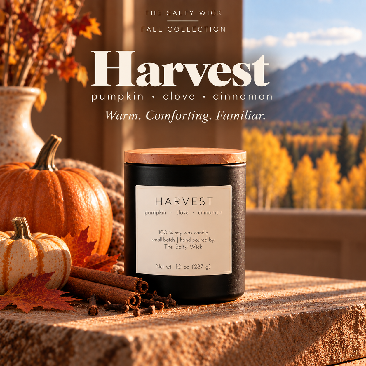 The Salty Wick Harvest soy candle with notes of pumpkin, clove and cinnamon, hand-poured in a matte black ceramic vessel with a natural wood lid.