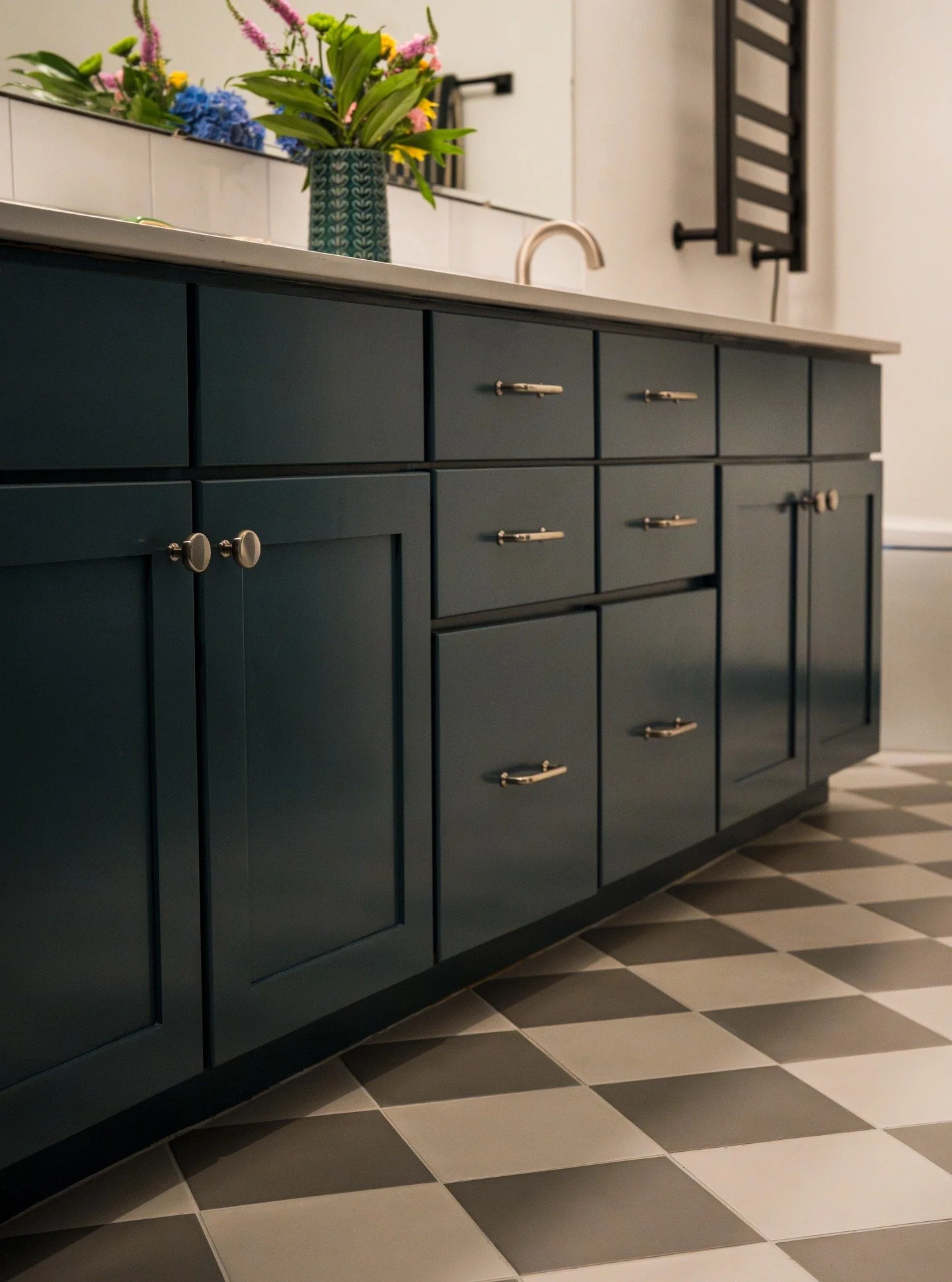 Our primary bathroom was a sea of brown and beige and the laminate cork flooring was peeling up and leaking water onto the ceiling of the kitchen. YIKES. We kept the layout and the vanity and tub and it feels like a completely different place. YAY!