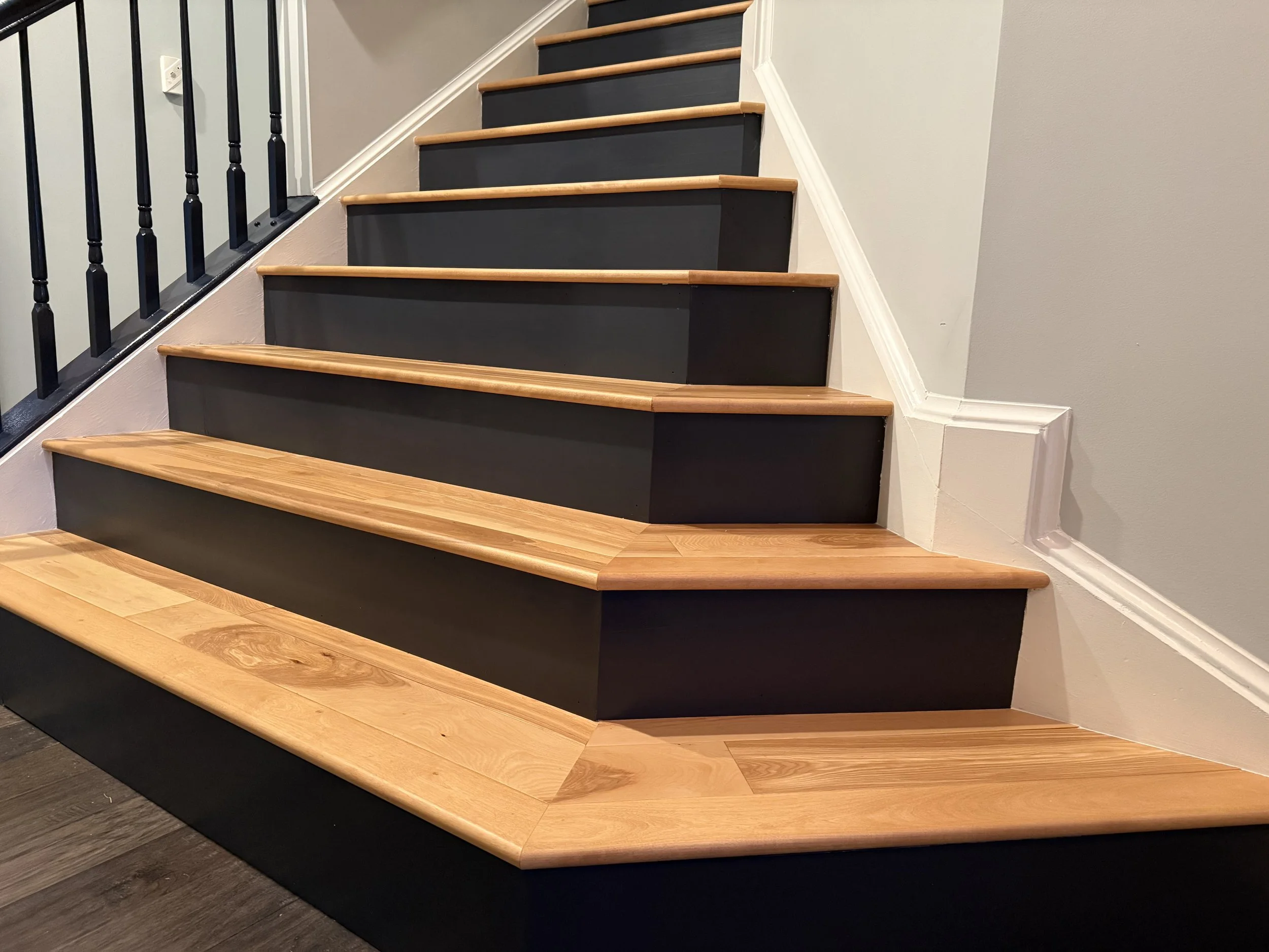 wood stairs with painted risers