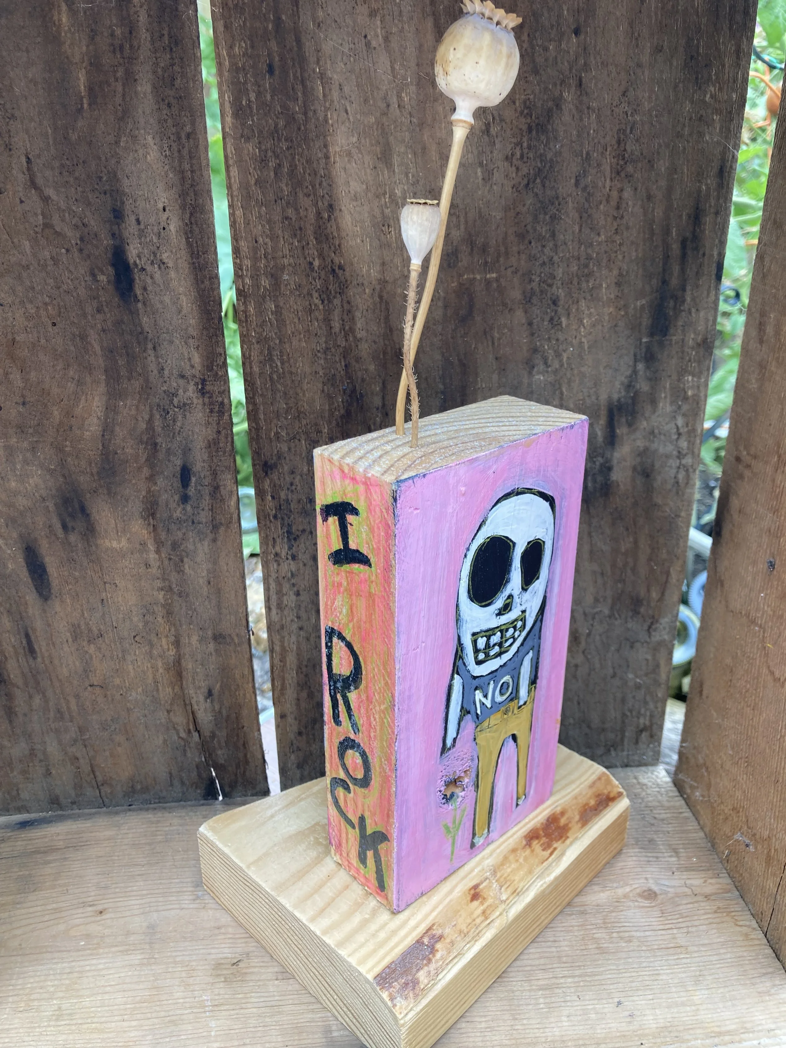 I Rock/Piss Off Mood Block $50. Salvaged wood and poppy pods.