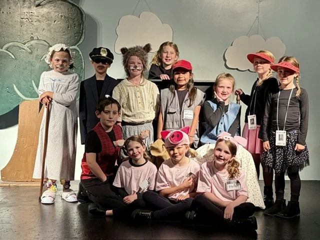 Young actors onstage in costume