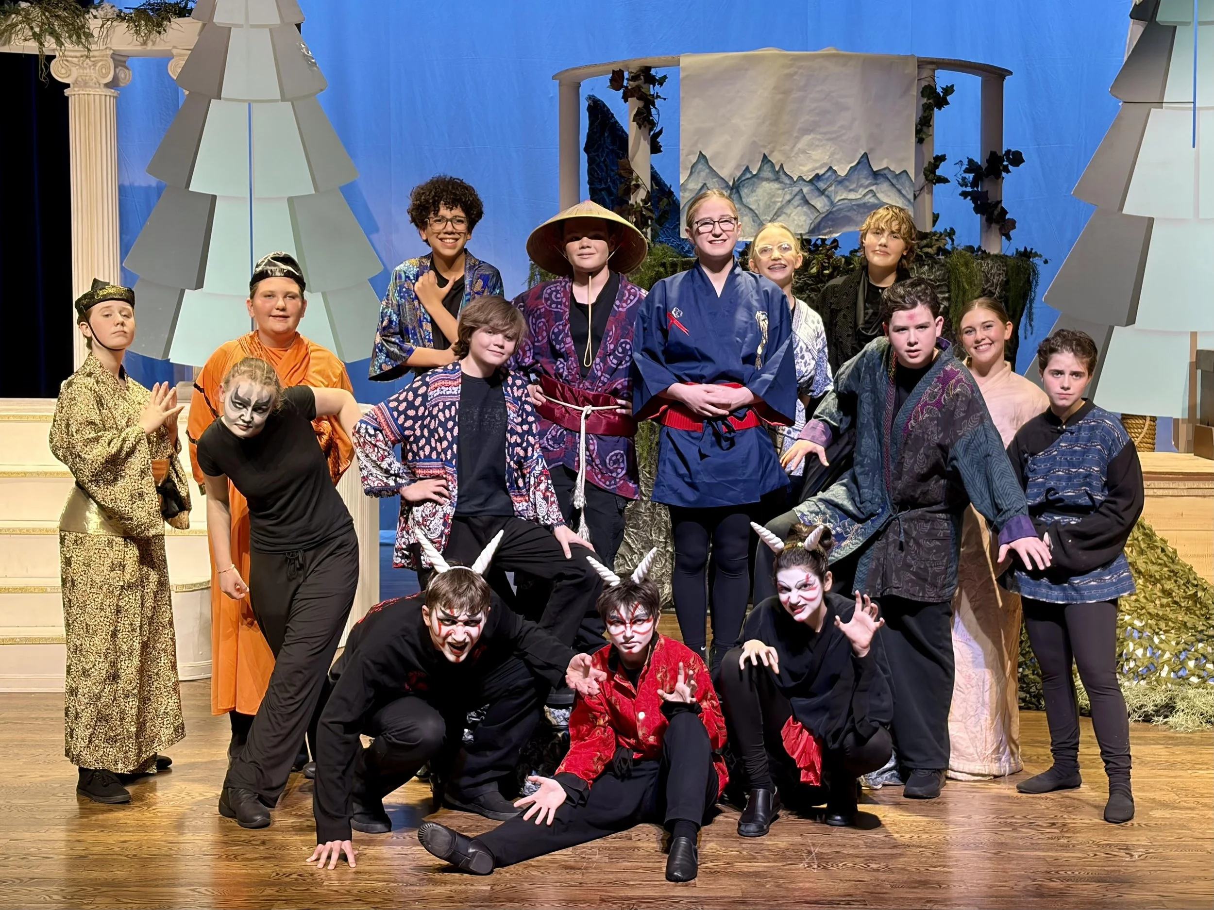 Group of students on stage after performance