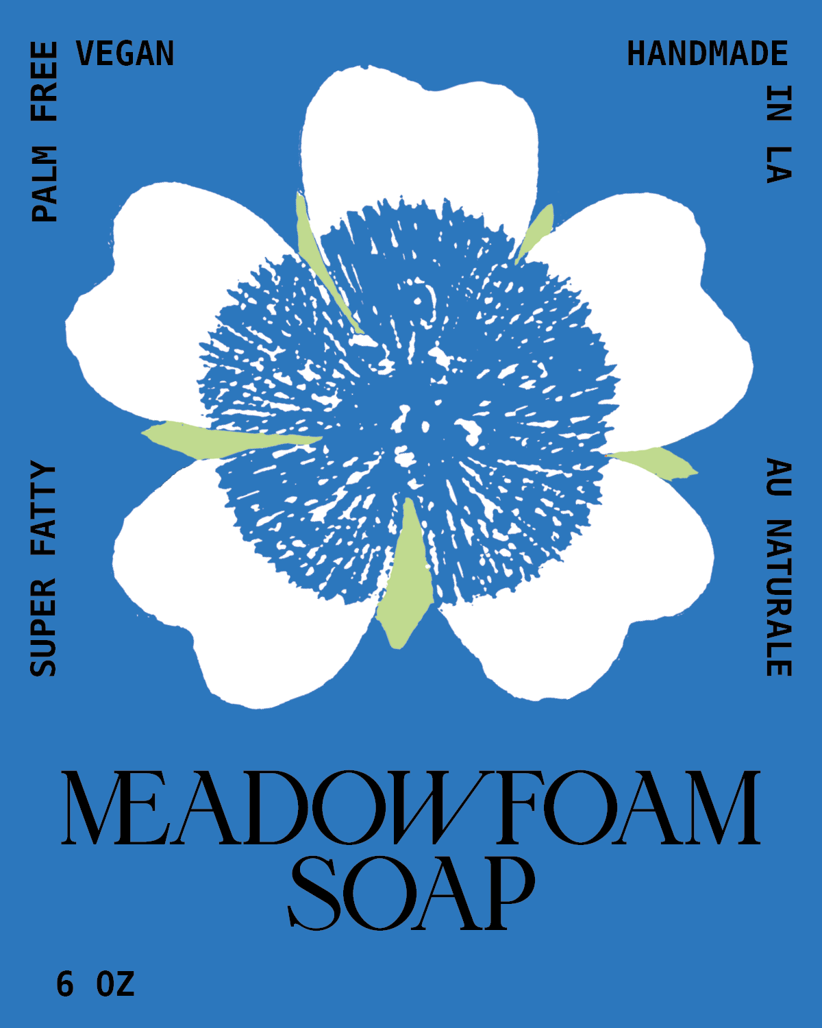 Blue background with white flower design, text reads "Meadowfoam Soap," "Palm Free," "Vegan," "Handmade in LA," "Super Fatty," "Au Naturale," "6 oz."