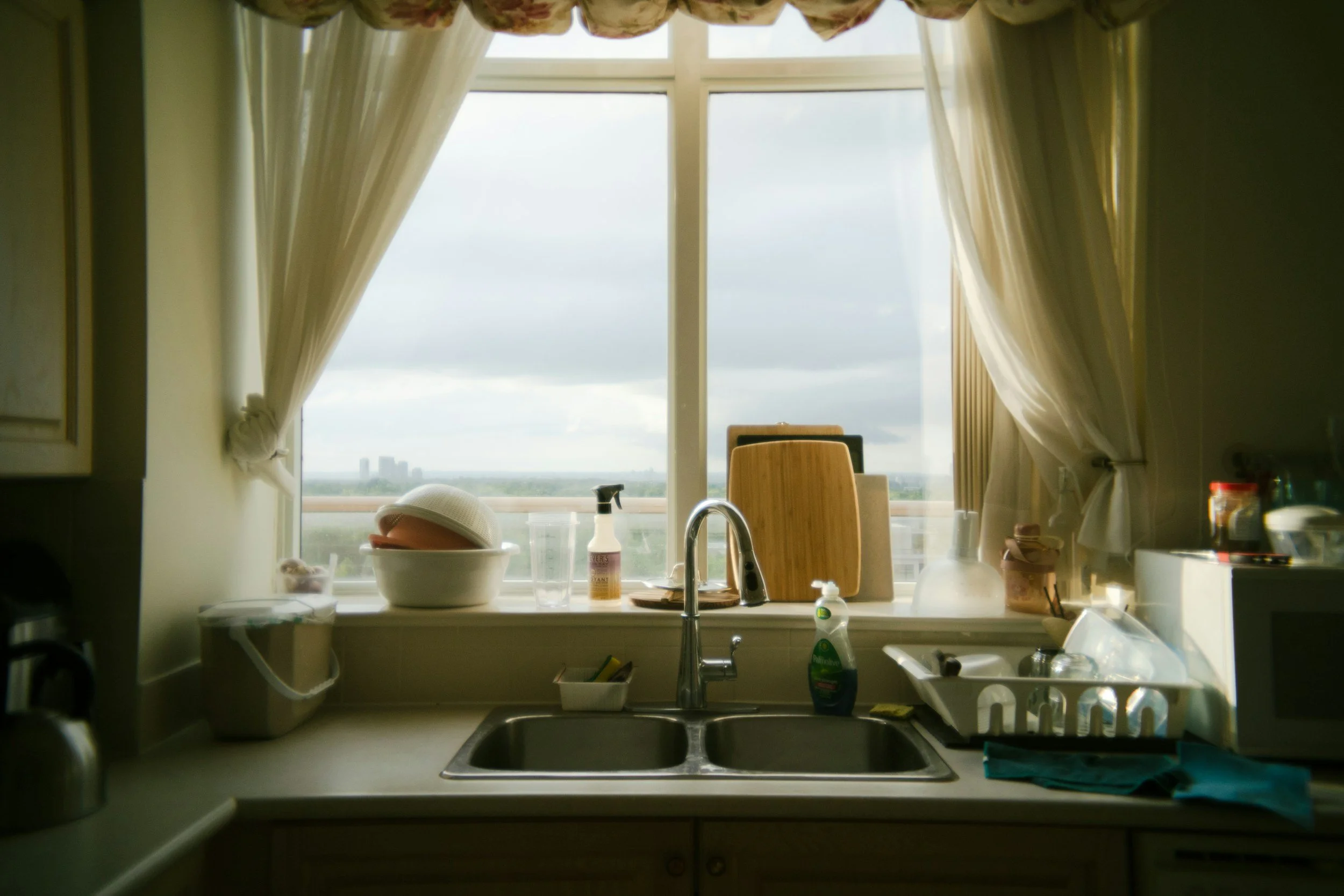 Picture of a window over a sink. For the Messy Millennial blog on your kitchen sink being a mental health metaphor of mental clarity.