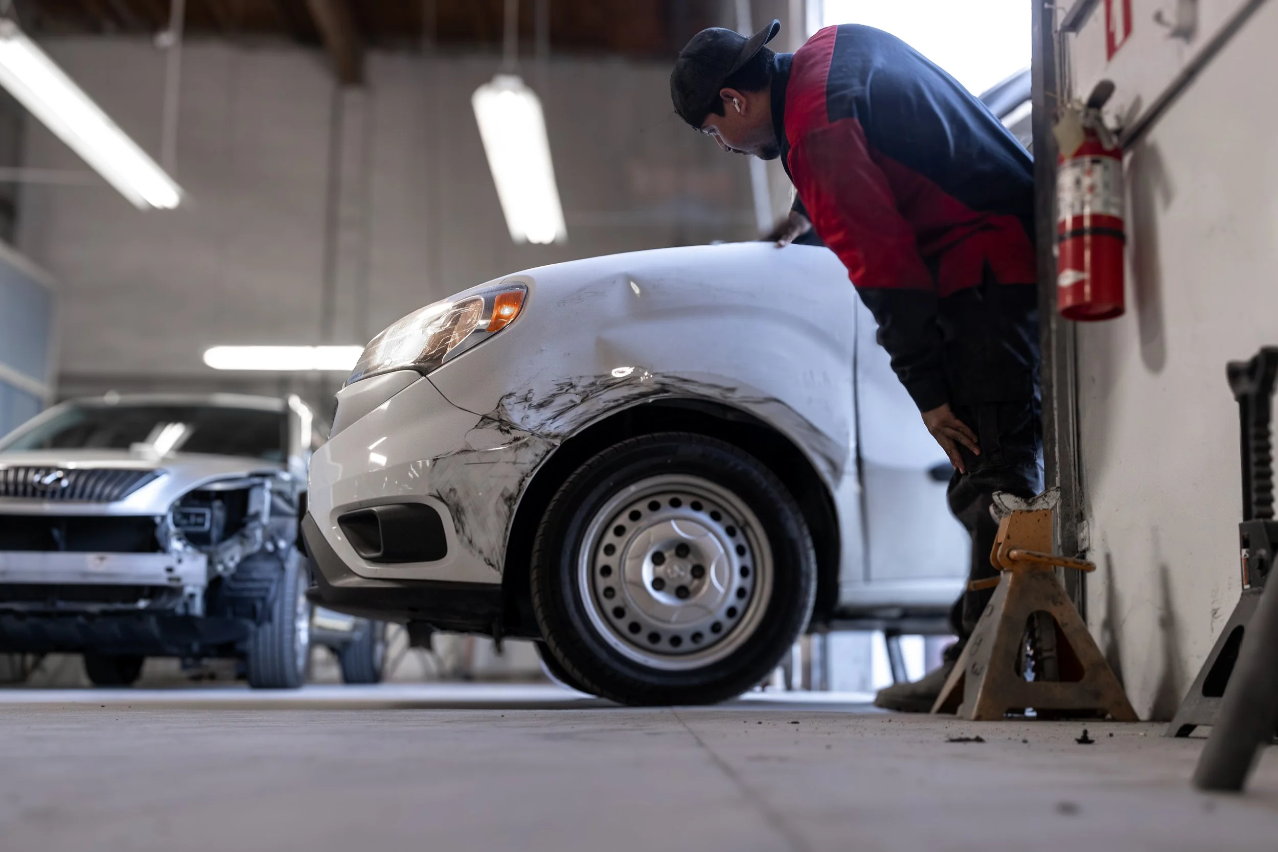 Visual collision repair inspection checking a vehicle for possible hidden frame damage in Oxnard