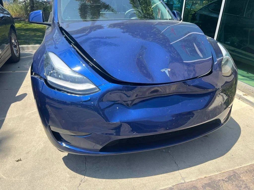 Tesla Model Y front-end collision damage in Oxnard before auto body repair