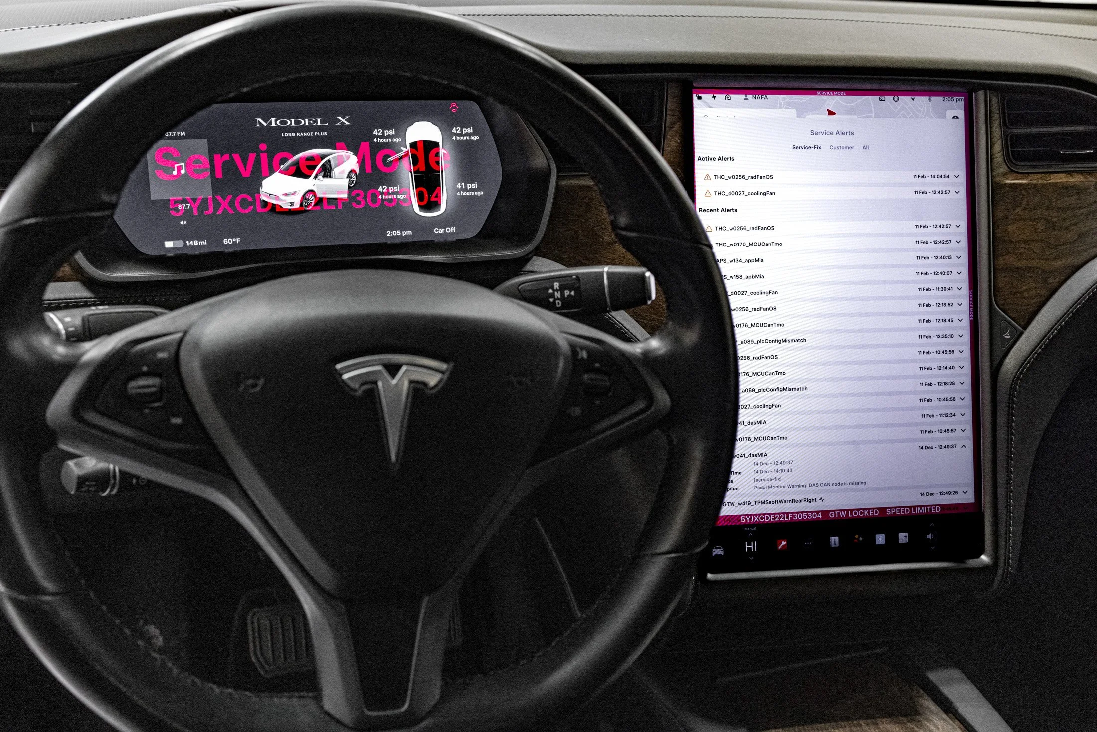 Tesla vehicle display showing service mode diagnostics during collision repair inspection ADAS