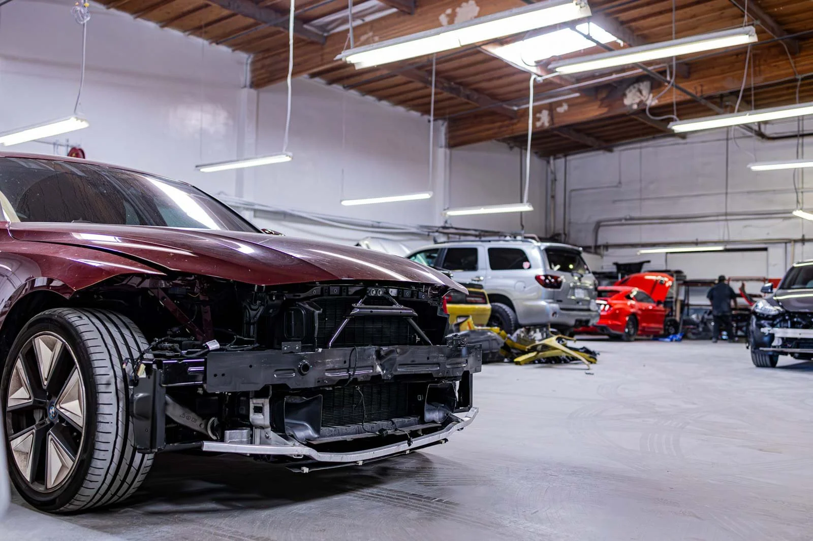 Vehicle undergoing collision repair inside an auto body shop in Oxnard during the accident repair process at Prestige Bodyworks