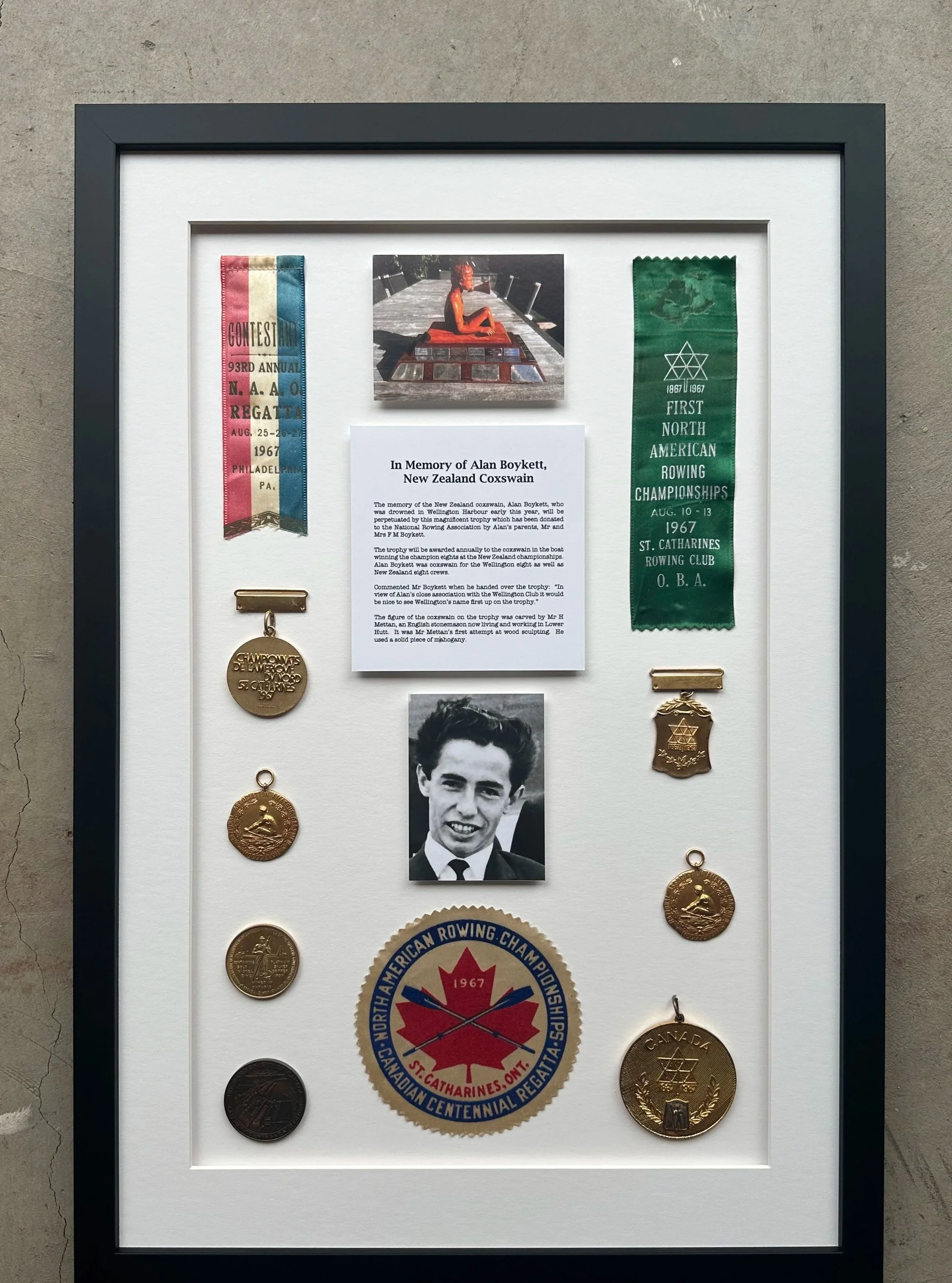 Minimalist wooden house with large window set against a mountainous landscape