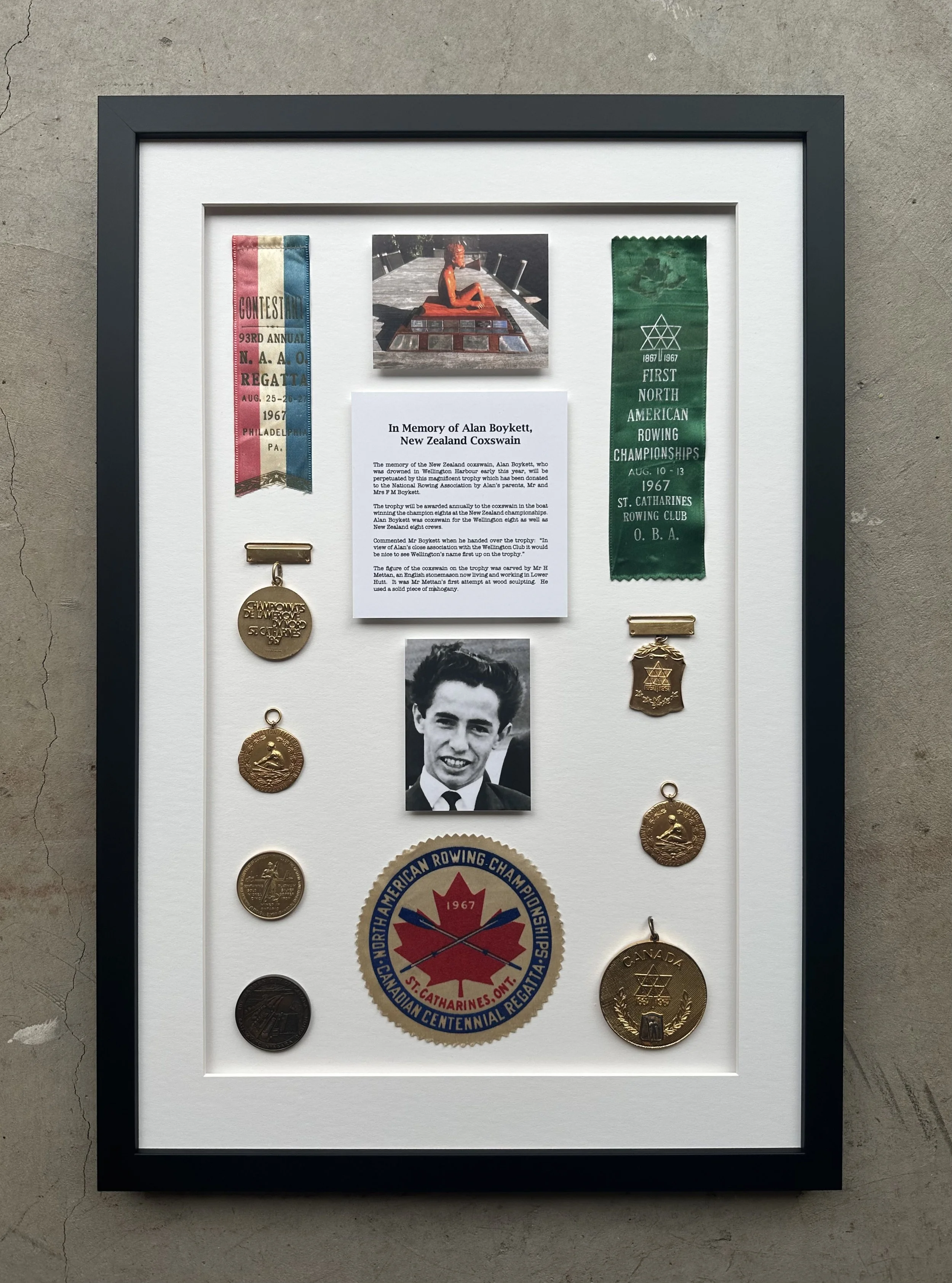 Minimalist wooden house with large window set against a mountainous landscape