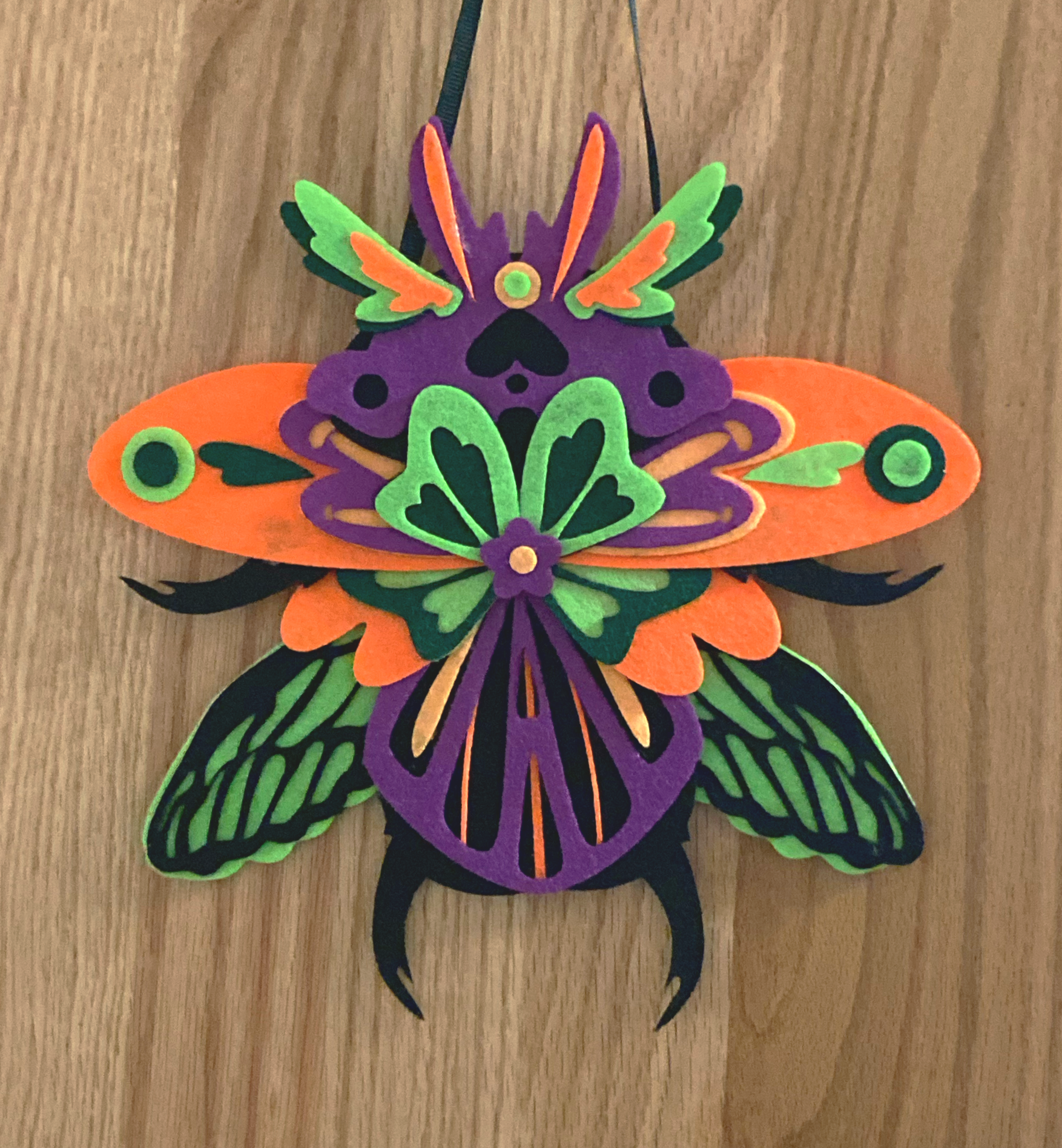 Laser cut layered felt bug wall hanging 