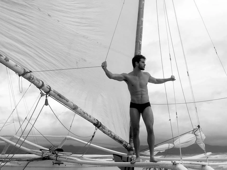 Kevin Côté as an international male model traveling the world, showcasing professional modeling experience