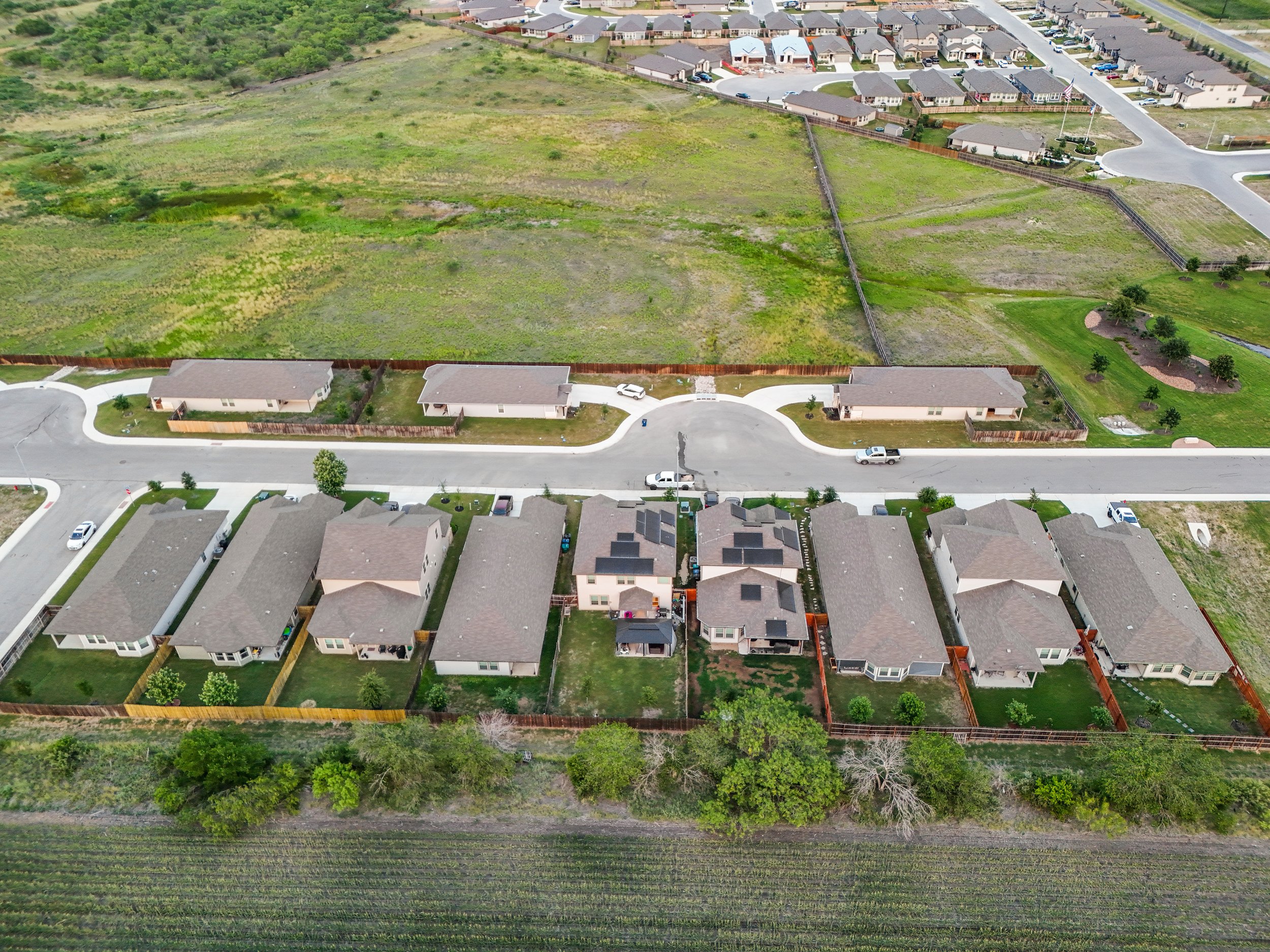 This is an unedited picture showing the width of the camera being able to capture the community in the same shot as the house.