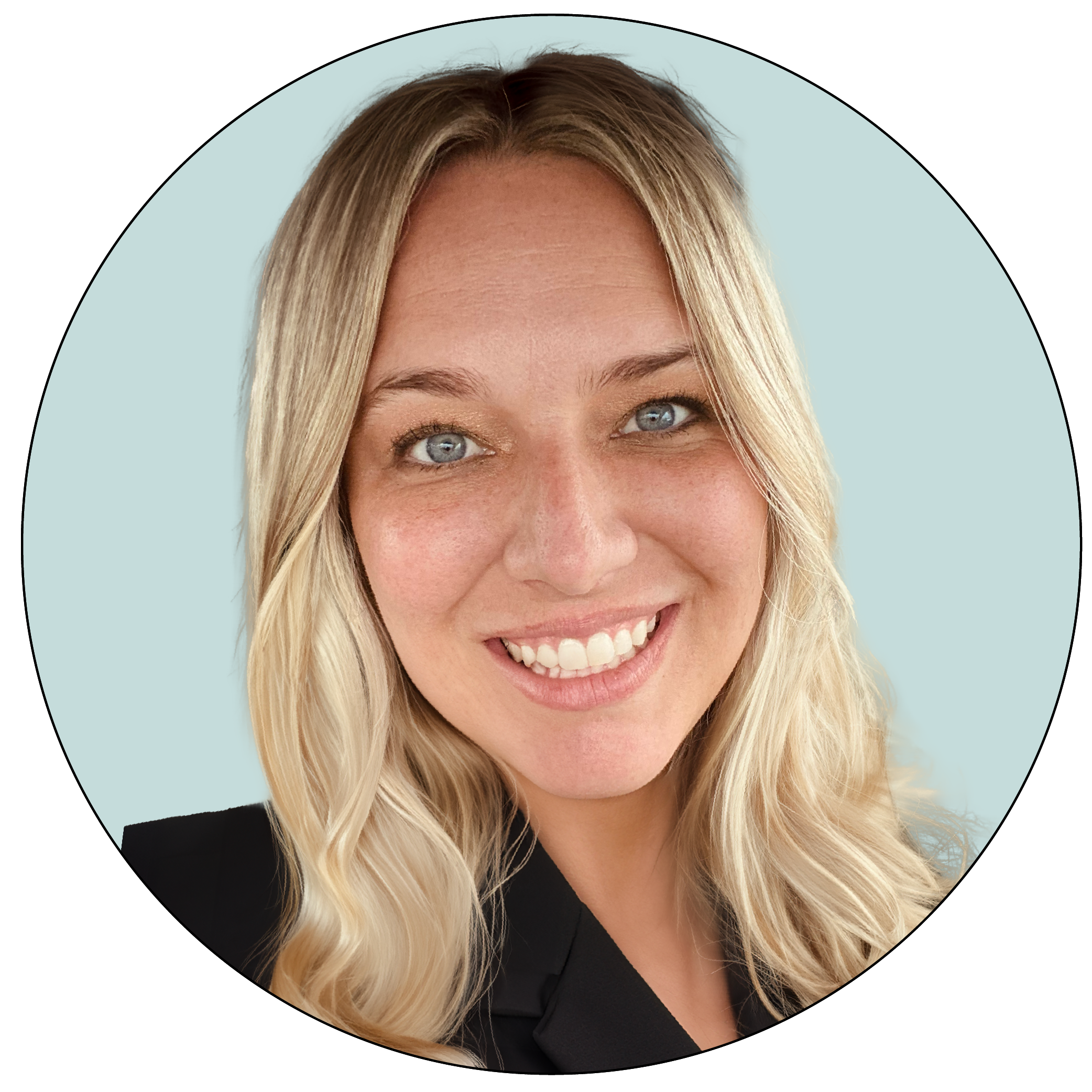Close-up of a blonde woman with blue eyes smiling, wearing a black top, against a light blue background.