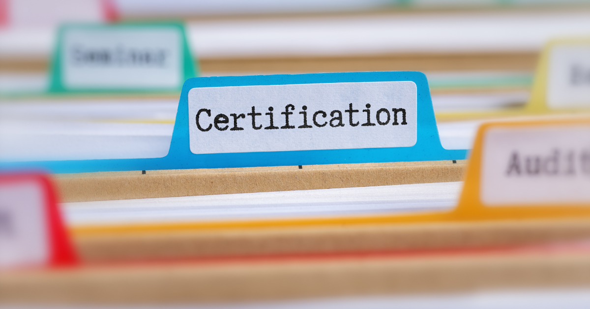 Organized file folders labeled “Certification,” representing compliance documentation required for government contracting readiness.