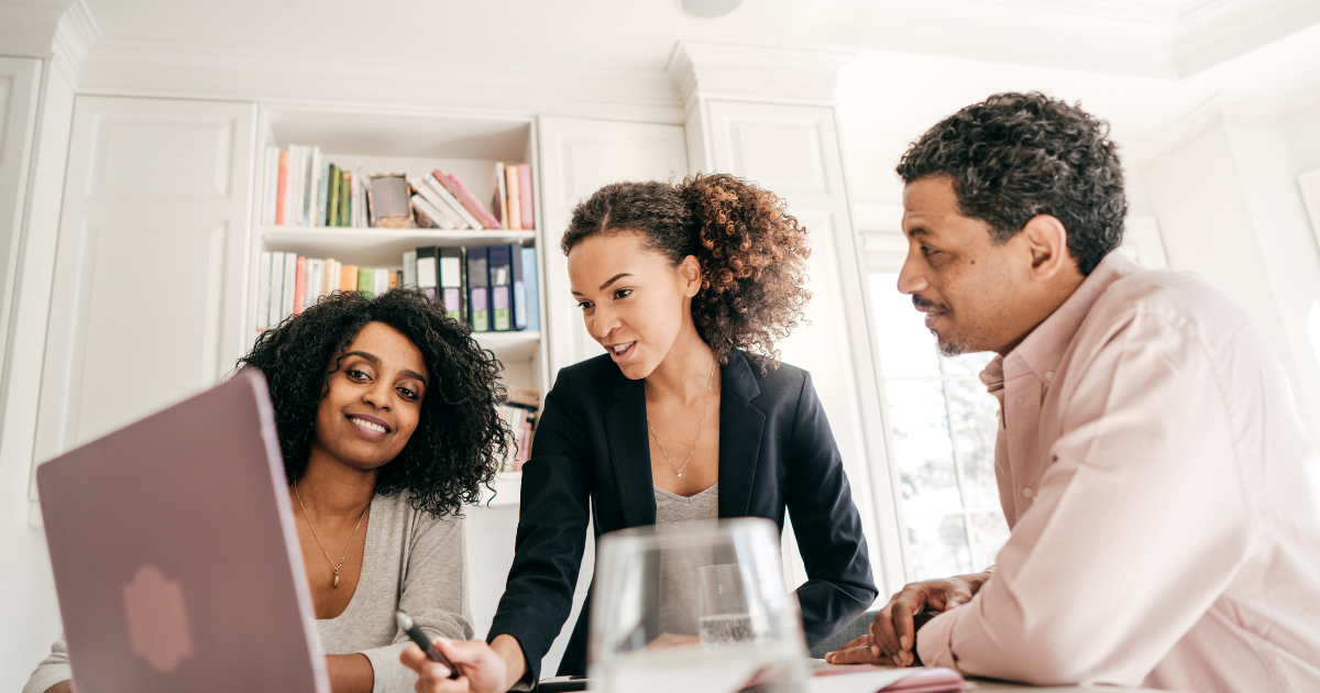 Small business professionals reviewing information together, representing collaboration and steady progress