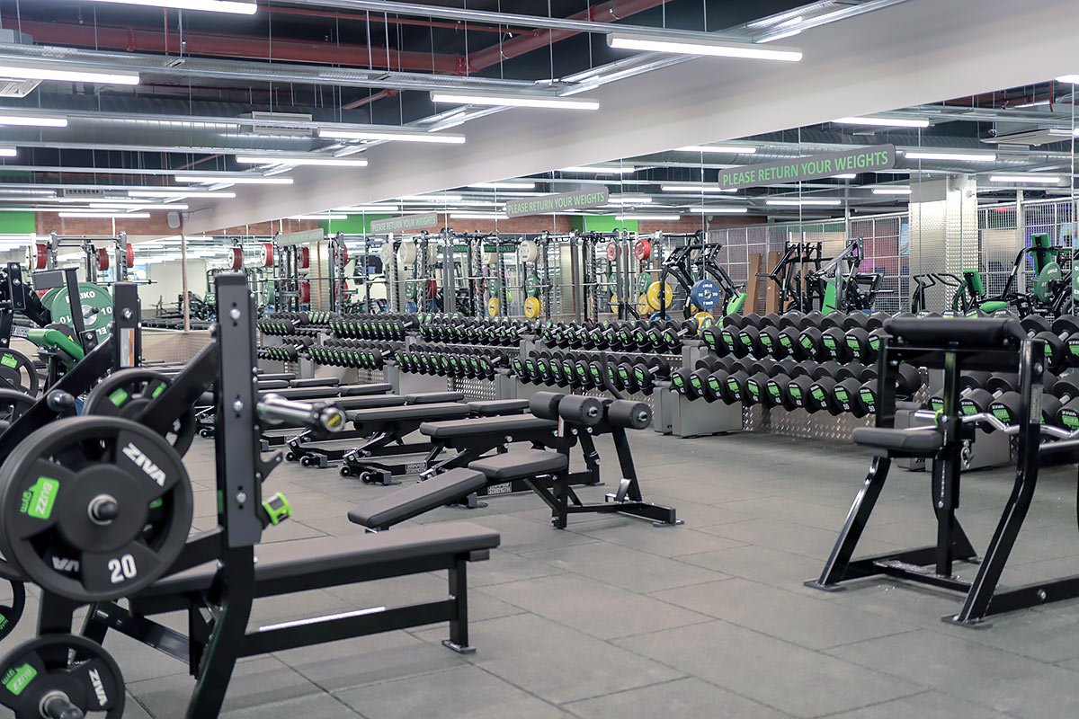 Free weights and strength training area at Buzz Gym Oxford with dumbbells, benches and resistance equipment.