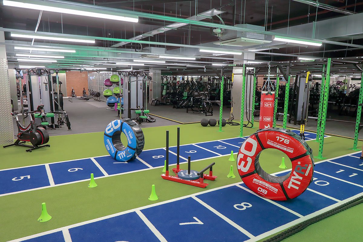 Functional training area at Buzz Gym Oxford with sled track, strength equipment and open workout space.