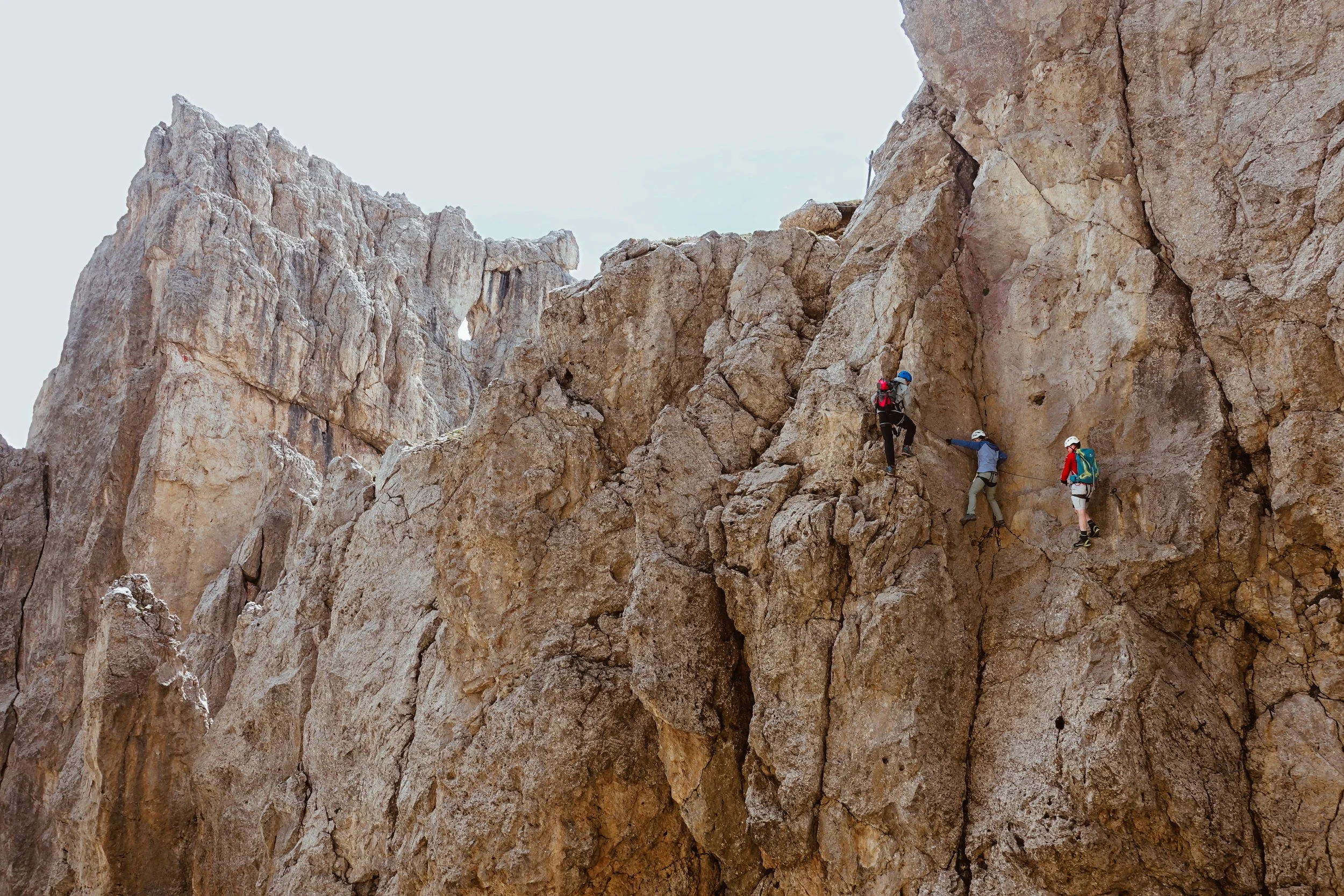 climbing-a-via-ferrata-with-a-mountain-guide-in-the-dolomites.jpg