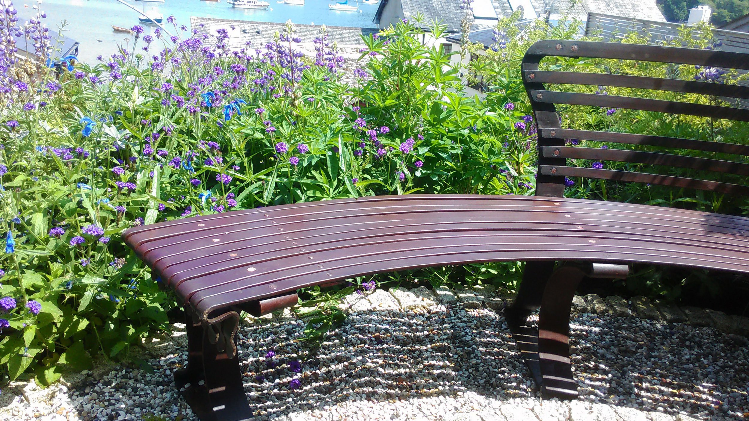 detail end of semi circular garden bench
