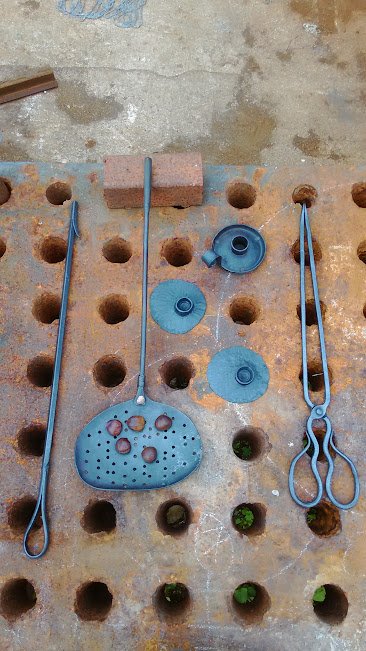 tongs, sconces, poker and chestnut roaster.jpg